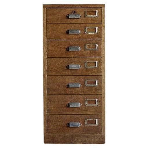 This vintage drawer cabinet was crafted in the Mid Showa Period (1926-).

Crafted from chestnut wood, it boasts a rich, deep color that exudes warmth and sophistication. 
It offers a neat storage solution for everyday documents and small items,