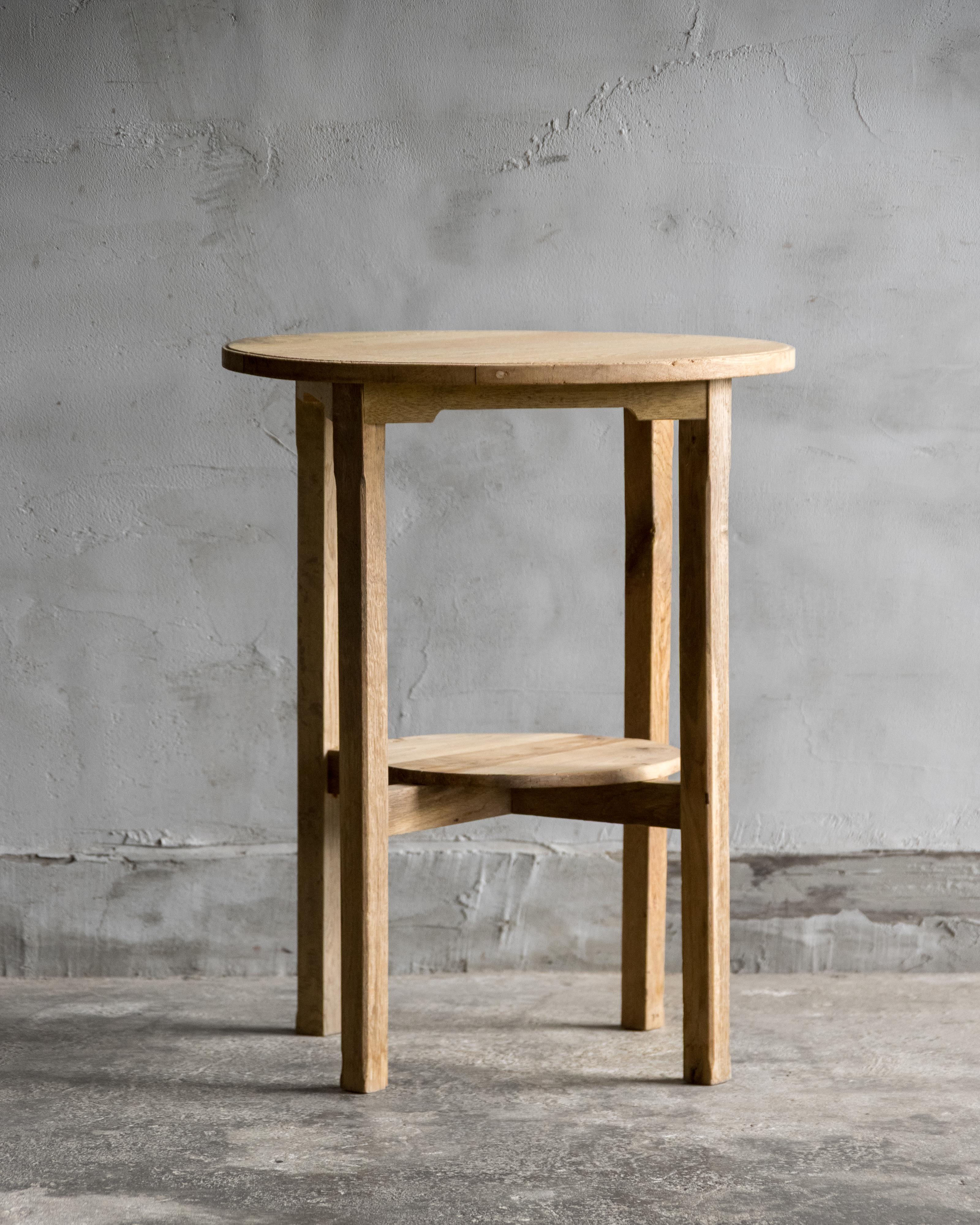 This Japanese vintage side table was crafted in the Early Showa Period (1926–), featuring a Japanese Sen wood top and Japanese oak legs.
Left in its natural wood tone, without added color or finish, the table reveals the quiet warmth of aged wood