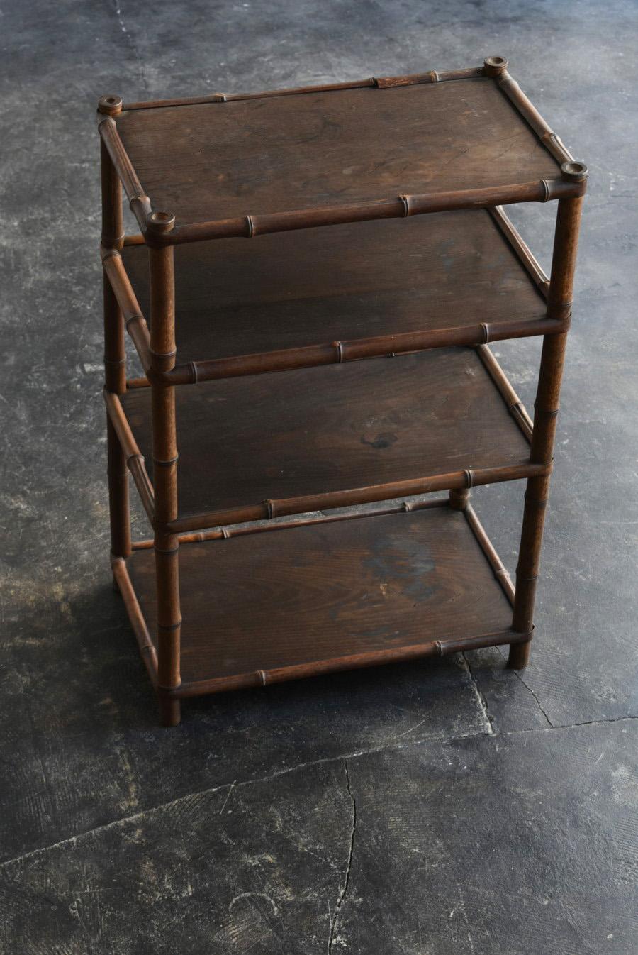 This is an old Japanese shelf made in the Meiji-Taisho period (1868-1920).

It is made of bamboo and chestnut board, and you can enjoy the unique grain of chestnut, and the sculptural bamboo frame is very beautiful.
Chestnut trees have been used