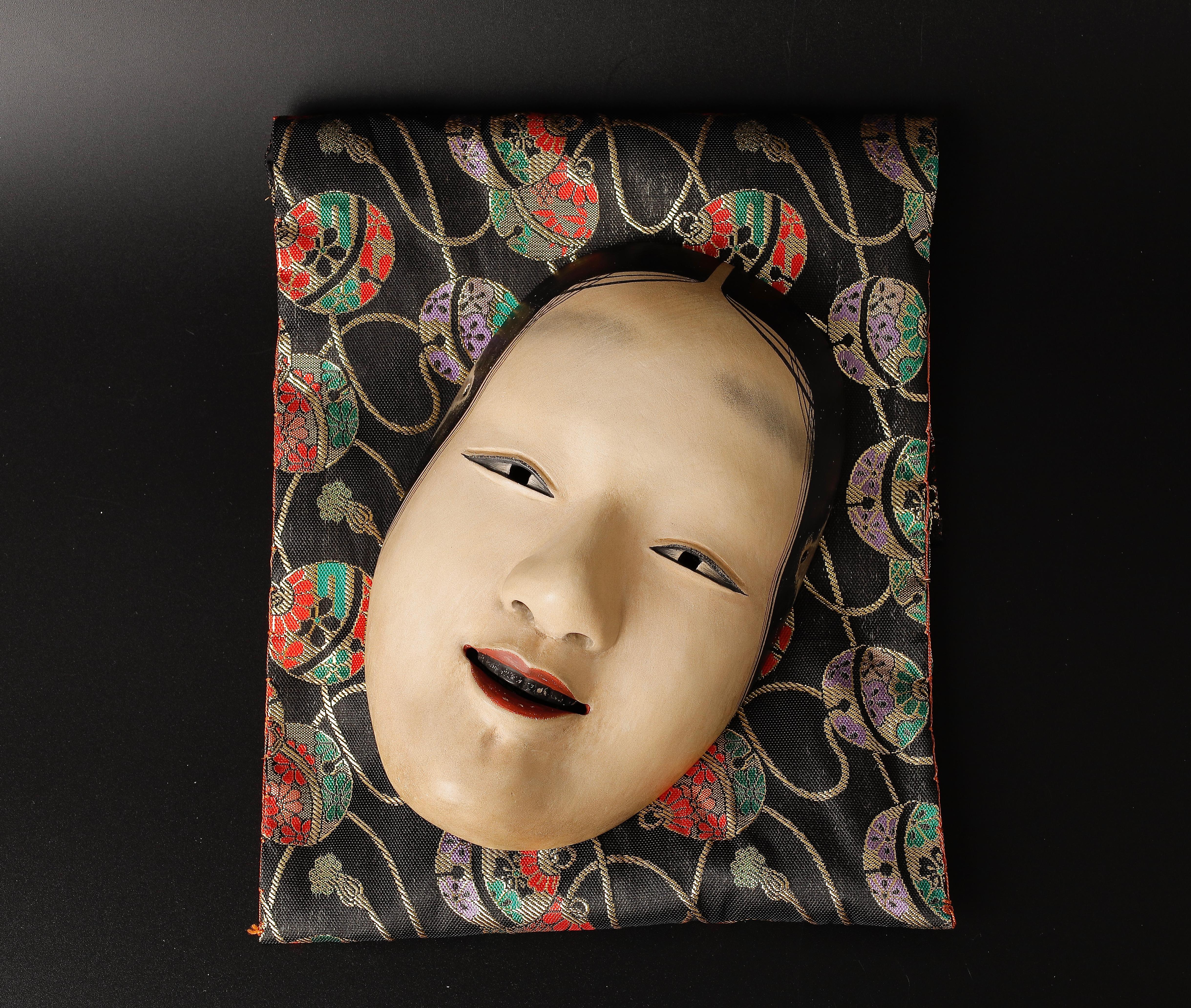 Waka onna Noh Mask representing a young woman
Dated: 1996 
Signed: Tairo
Size: 13.5 x 21.5 x 7 cm (5.5 x 8.5 x 3 inch)
Weight: 130g (0.3 lb)
Material: wood with gofun paint

Good condition, some minor abrasions as you see in photos.


