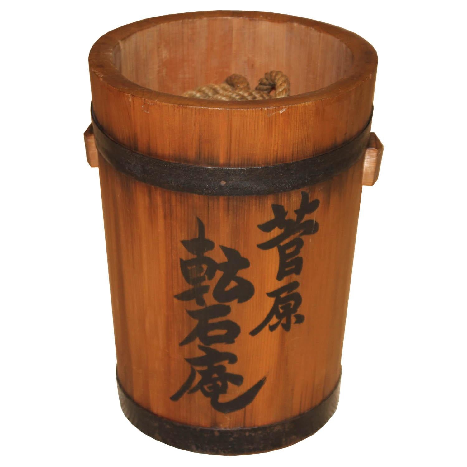 Handmade wood bucket was used in a tea house to draw water from a well. Kanji letter on bucket says, Tensekian, name of the tea house and the other side is the owner's name, Sugawara.