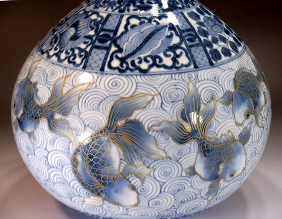 Unique large Contemporary porcelain decorative vase, hand painted in beautiful shades of blue on an elegant bottle shaped porcelain body, a signed piece by widely acclaimed Japanese master porcelain artist in the Imari-Arita tradition. In 2016, the