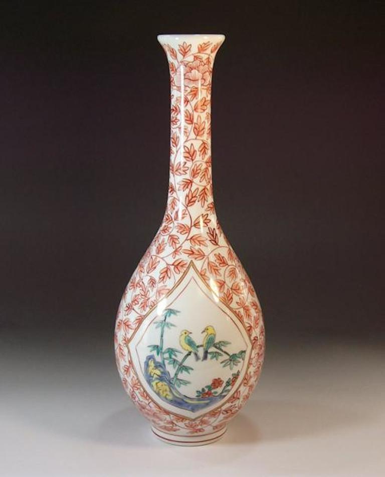 Exquisite contemporary Japanese porcelain decorative vase hand painted in red, white and green on a beautifully shaped body, a signed work by highly acclaimed Japanese master porcelain artist in Imari-Arita tradition of Japan. He has received