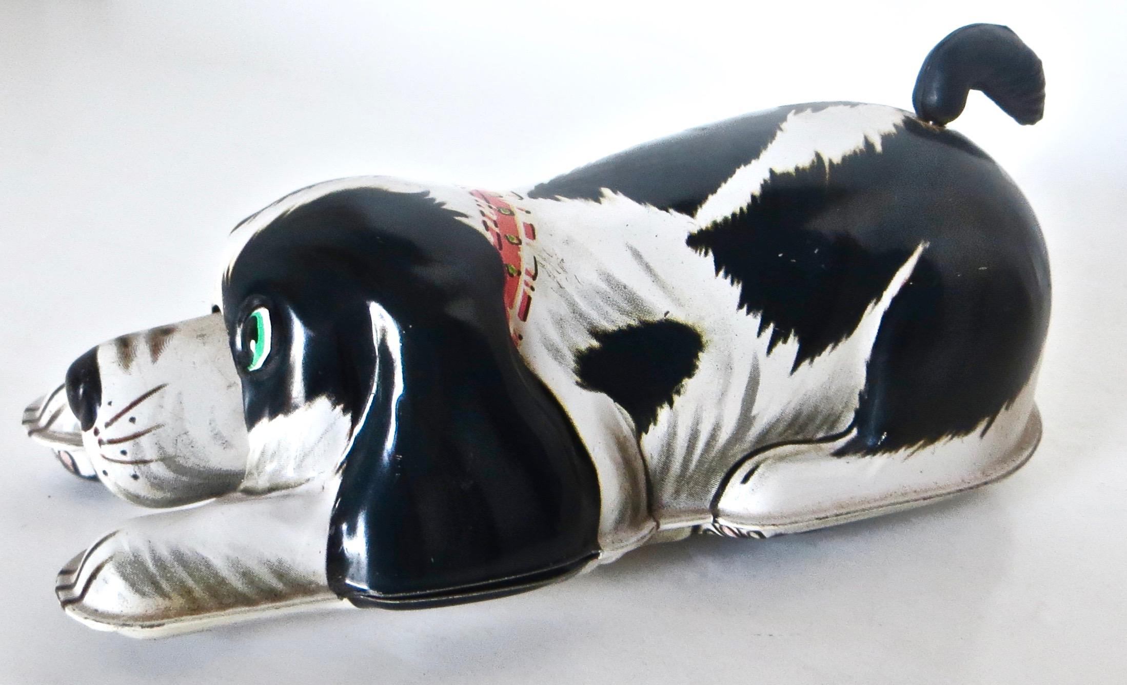 Made of tin with a rubber tail, this toy was manufactured by The Nomura Toy Industrial Company Ltd., Japan; note 
