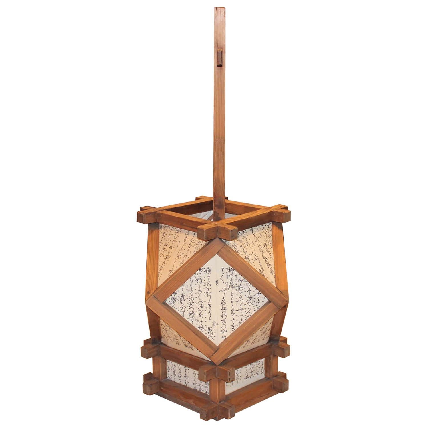 Japanese wood lantern (andon) was originally used as mobile light for indoor use. Original frame has been re-papered with Japanese rice paper. Taisho period.