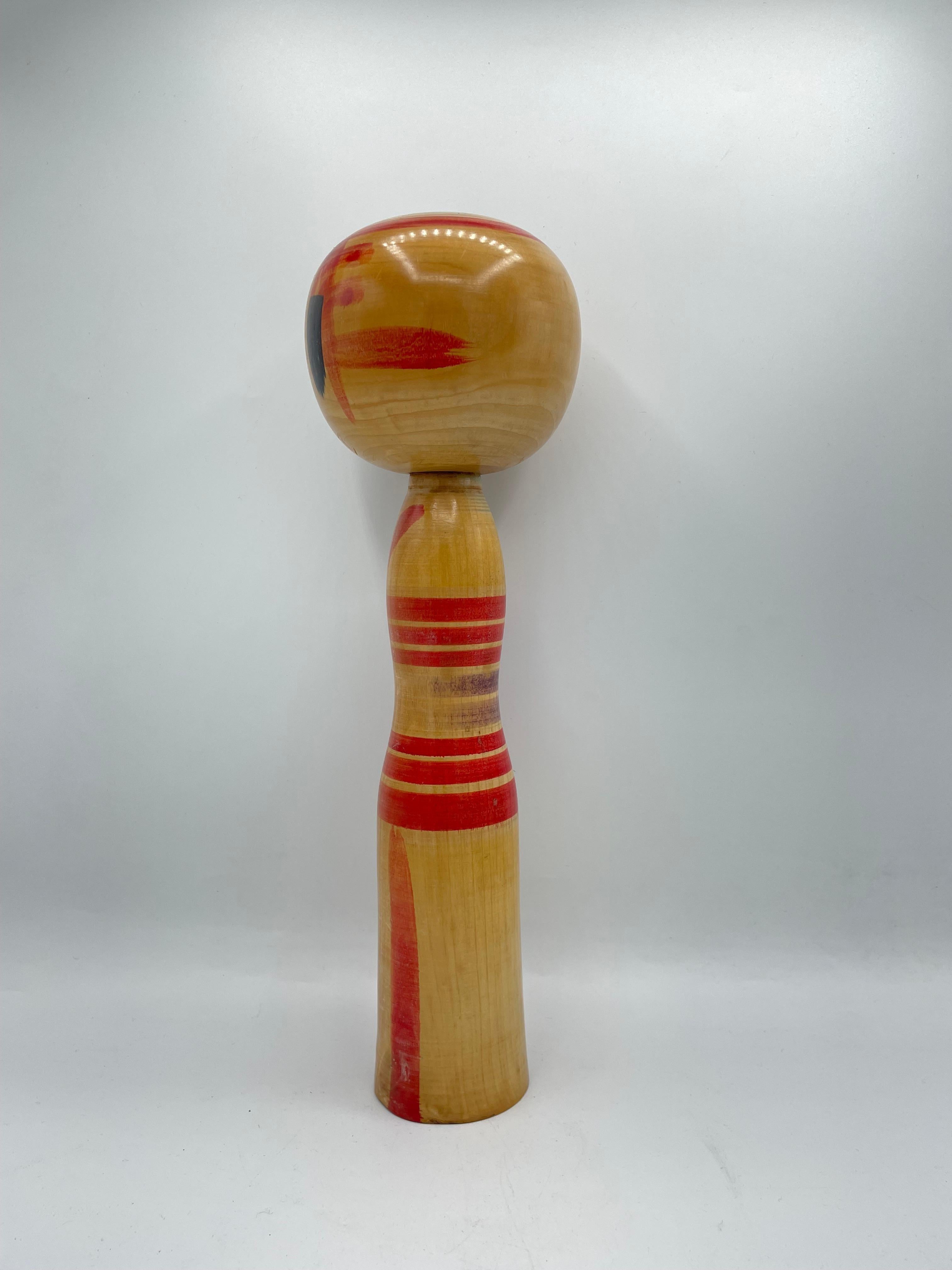 This is a wooden doll which is called Kokeshi in Japanese.
This kokeshi was made in Japan around 1970s by kokeshi artist Hisashiro NIIYAMA.
He was born in Miyagi prefecture in 11th May 1942. His signature is written on the bottom of this kokeshi