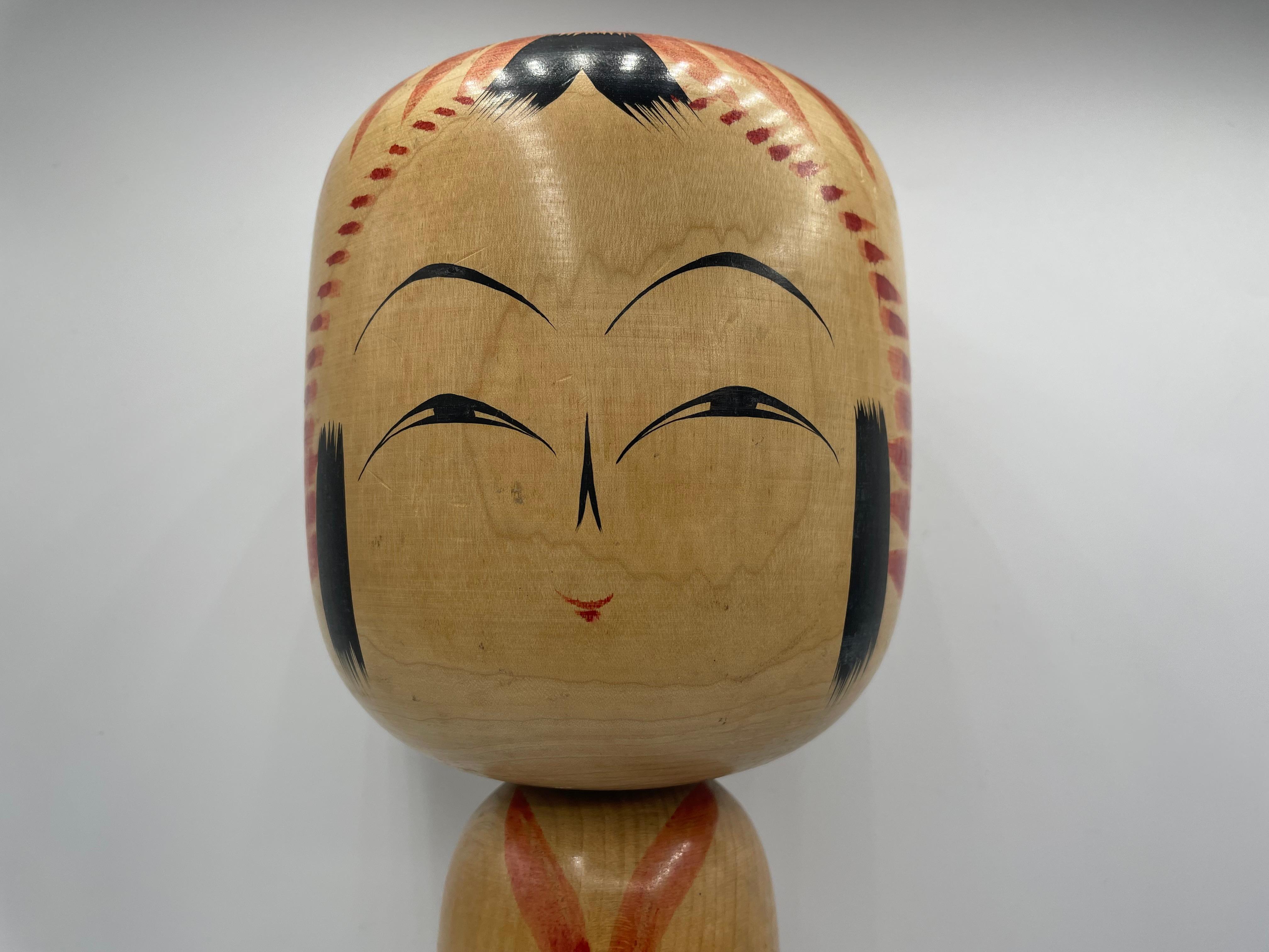 This is a wooden doll which is called Kokeshi in Japanese.
This kokeshi was made in Japan around 1970s by kokeshi artist Kyuichi OMORI.
He was born in 30th November 1932. His signature is written on the bottom of this kokeshi doll.
This kokeshi was