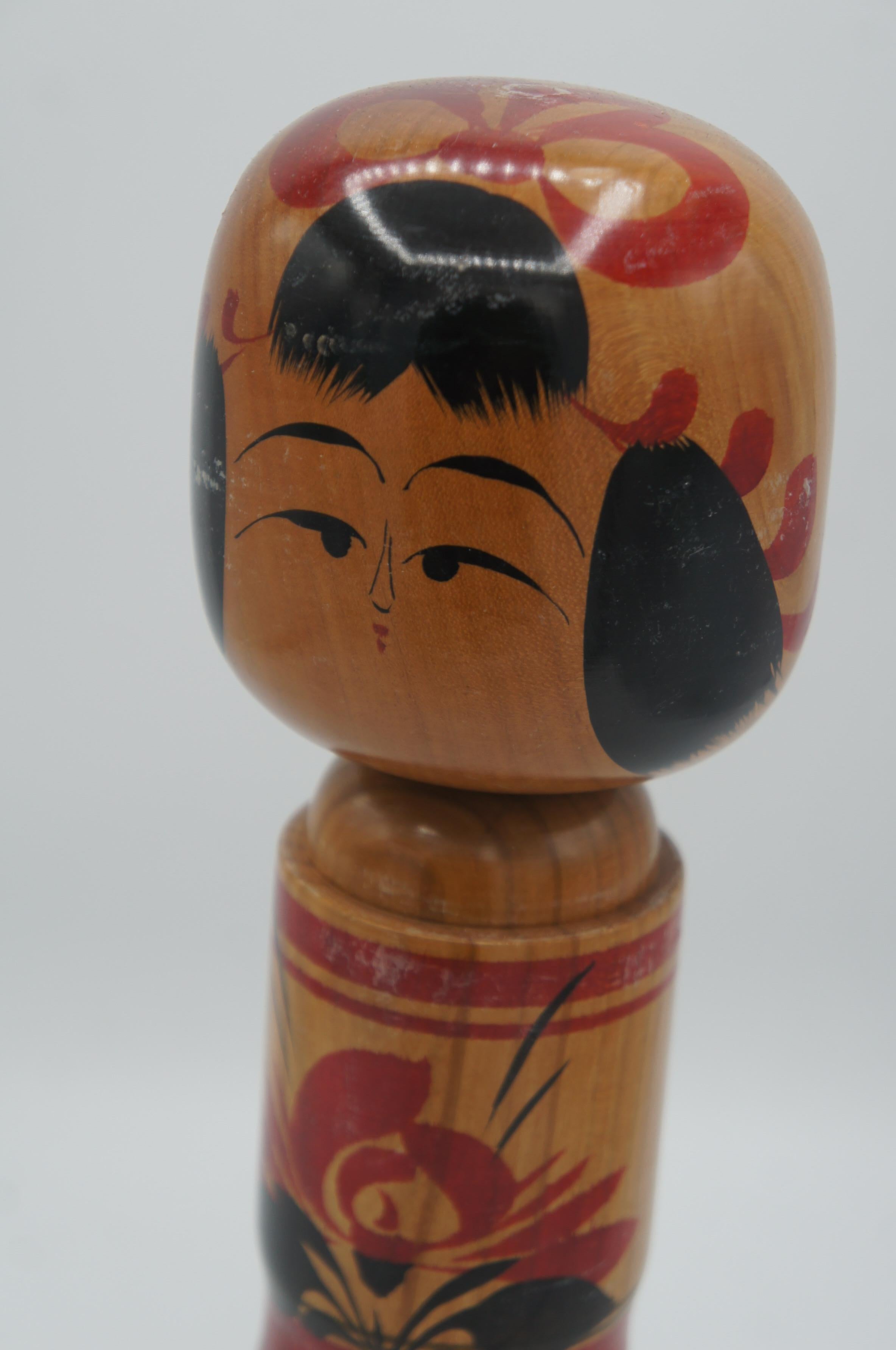 This is a wooden doll which called Kokeshi in Japanese.
It was made by Masayuki KAGANUMA who was born in 1936. This kokeshi doll was made in 1977.

Dimensions: 9 x 9 x H30 cm

Kokeshi are simple wooden Japanese dolls with no arms or legs that have