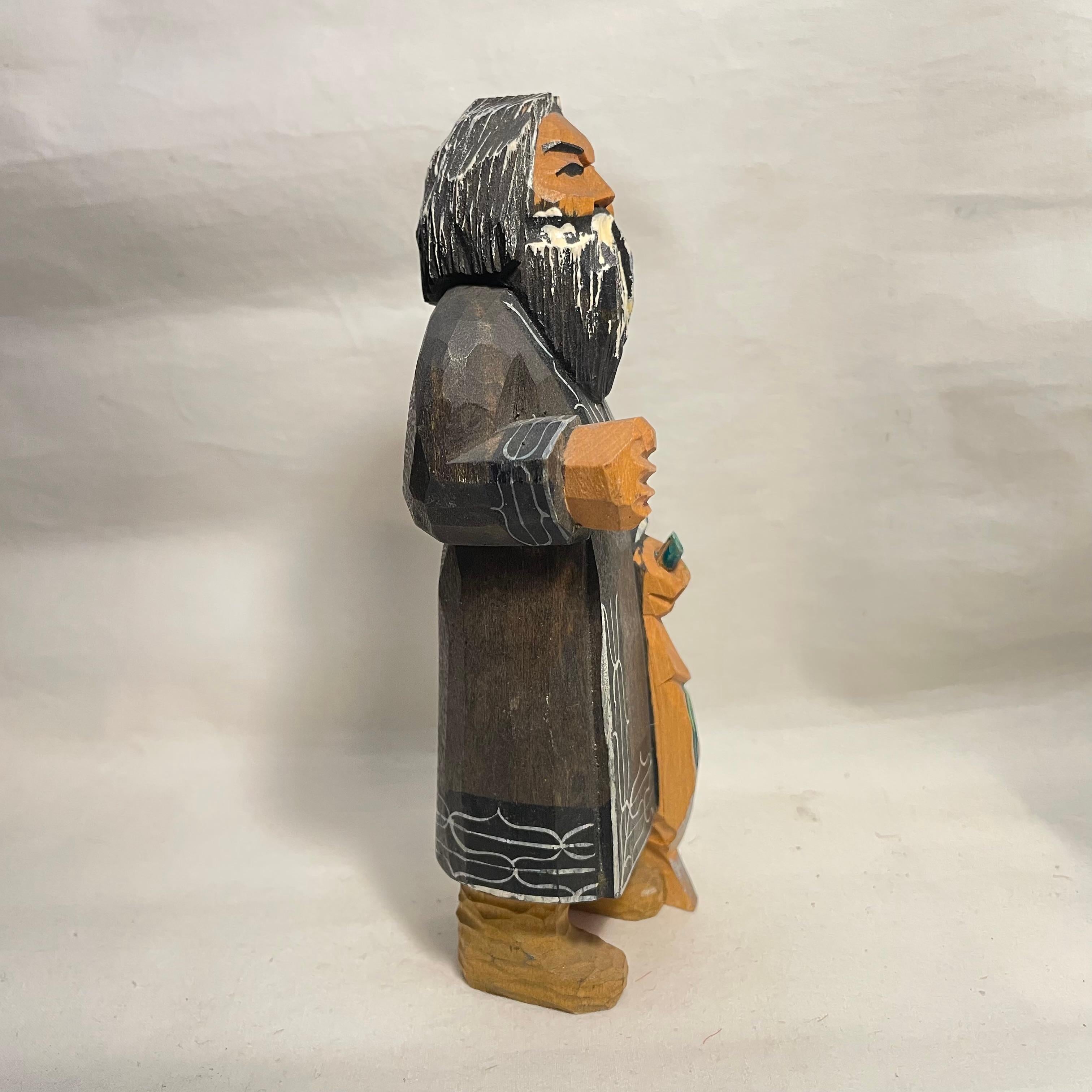 This is an object of a person from Hokkaido prefecture in Japan.
They are called Ainu. 
This object is all hand carved. It was made around 1980s in Showa era.
It is made with wood.

Dimension: 6 × 4.5 x H 14.5 cm

＊The Ainu are an Indigenous people