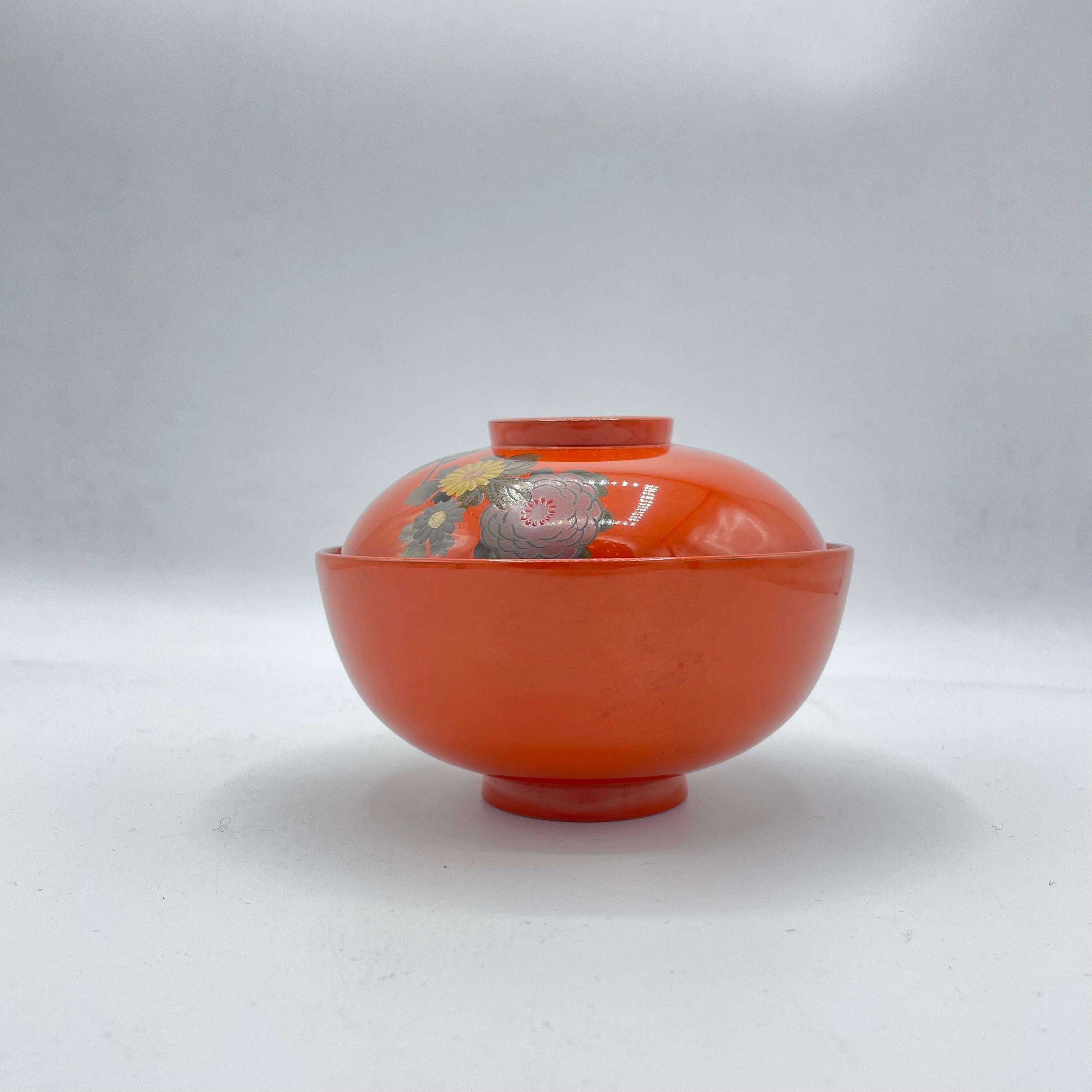 This red lacquer soup-bowl was made in Japan around 1970s in Showa era.
This bowl is made with wood and there is a motif of flowers.

Dimension: H9 × 12 × 12 cm 