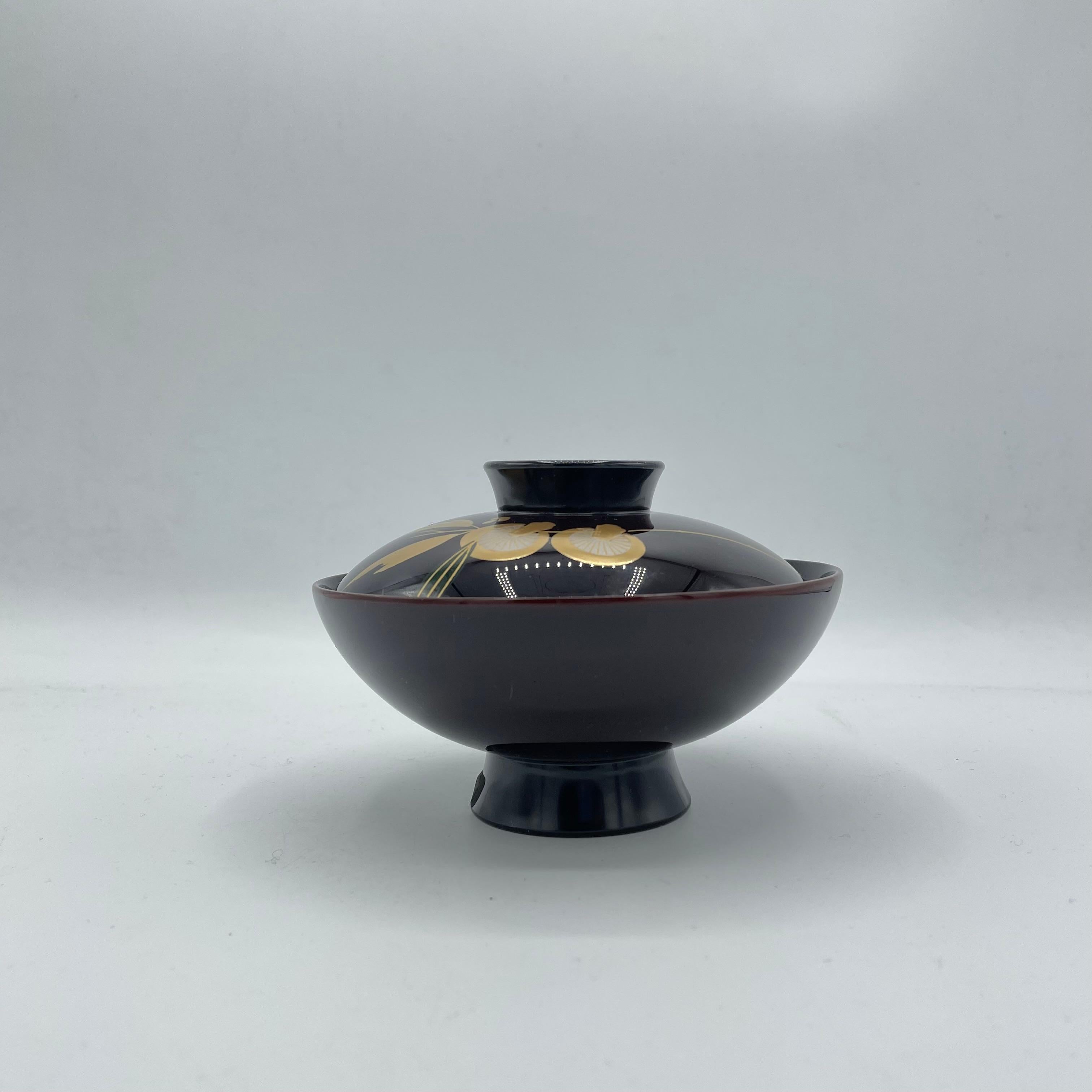 This is an antique Japanese soup-bowl made around 1990s with wood. This soup-bowl is made with wajima-nuri, a Japanese lacquerware from Wajima, Ishikawa prefecture in Japan. Wajima-nuri is made by the applying multiple layers of urushi mixed with