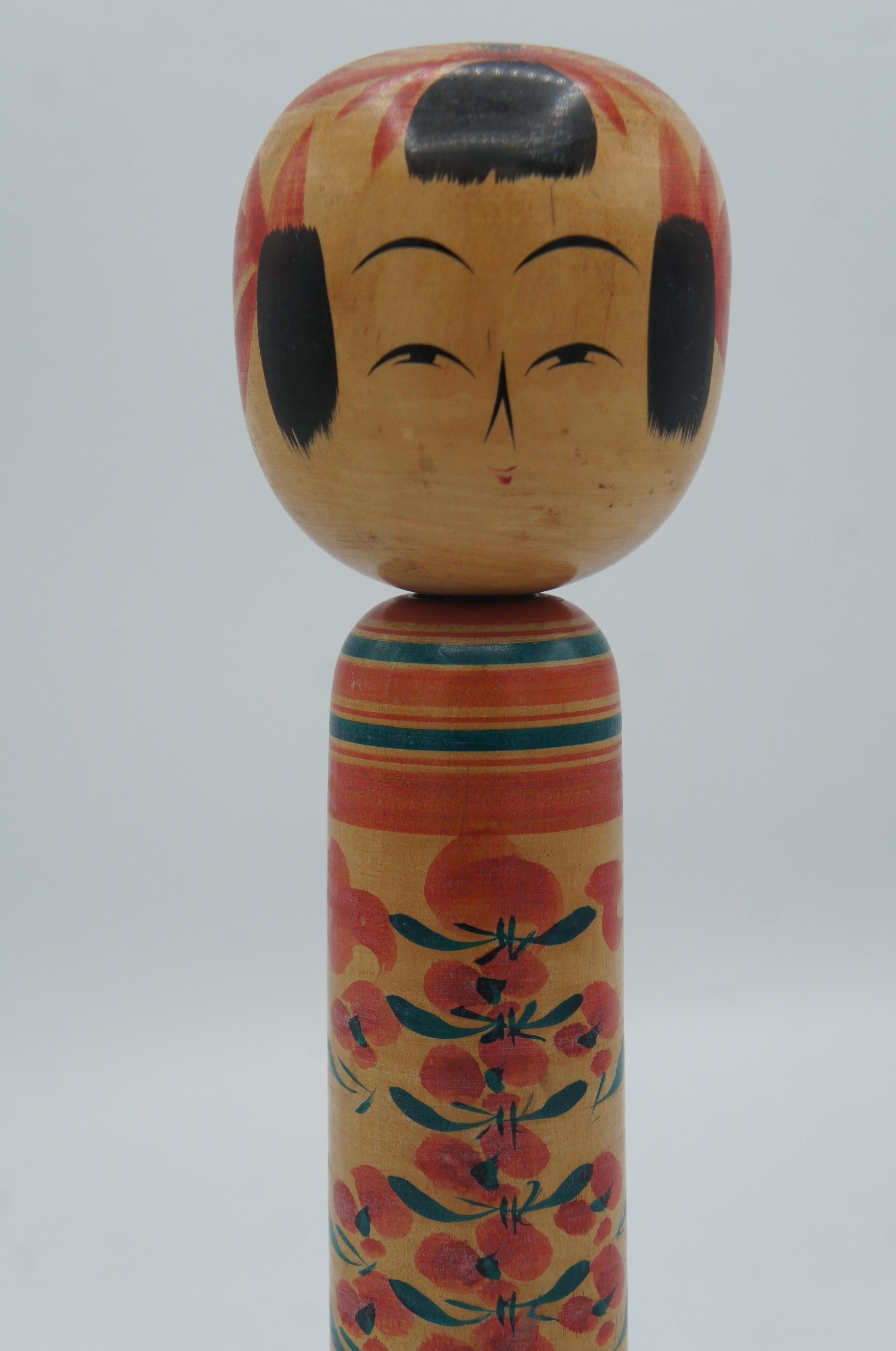 This is a wooden doll which is called Kokeshi in Japanese.
This kokeshi was made in Japan around 1970s by kokeshi artist Chujiro KOBAYASHI.
He was born in Yamagata prefecture in 13th March 1932. His signature is written on the bottom of this kokeshi