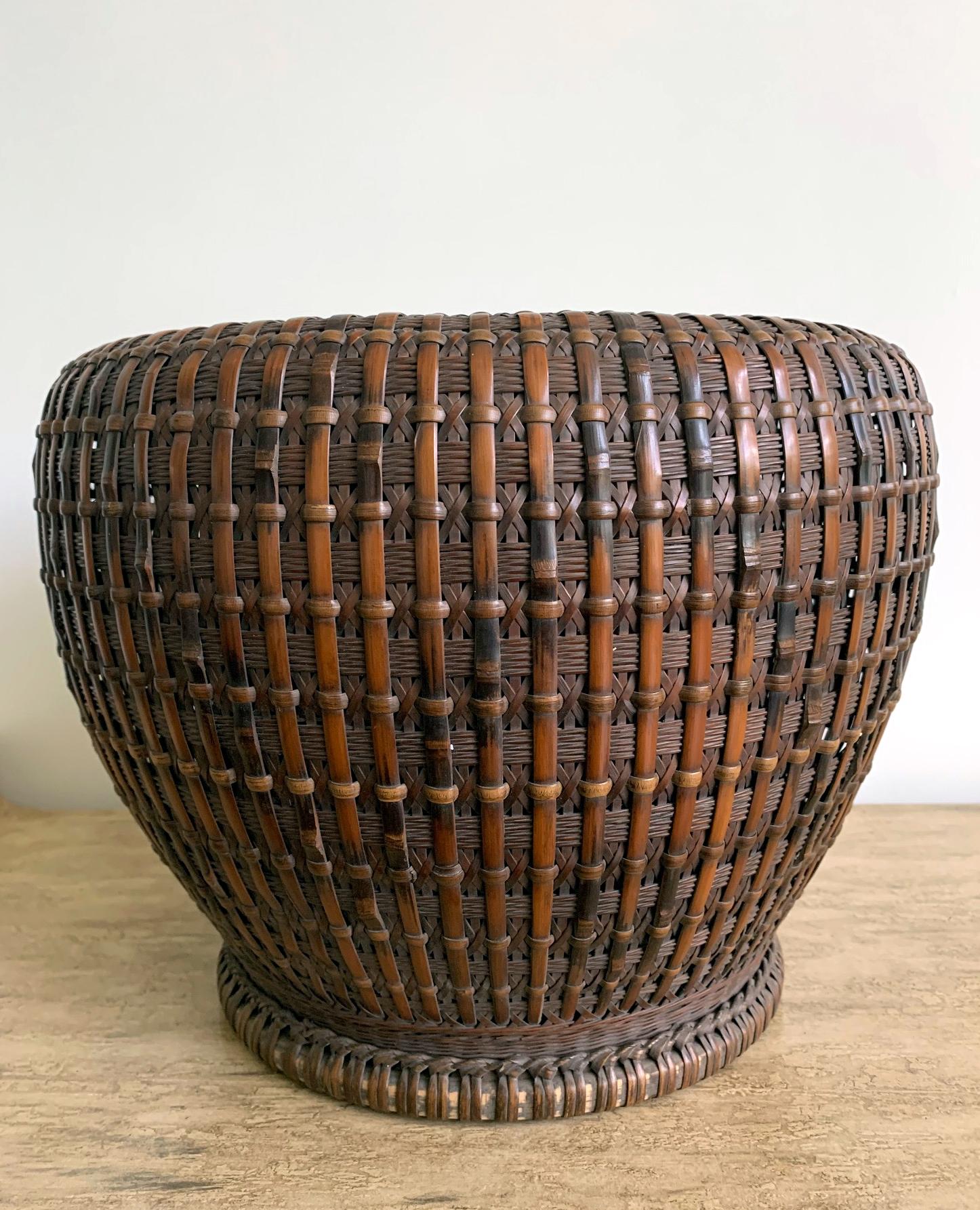 An important piece of bamboo basketry art by Maeda Chikubosai I (1872-1950), circa 1920s-1930s. The body of the bamboo brazier was made with smoked bamboo (susudake) and rattan and with a built-in copper liner brazier. Mat plaiting, diagonal