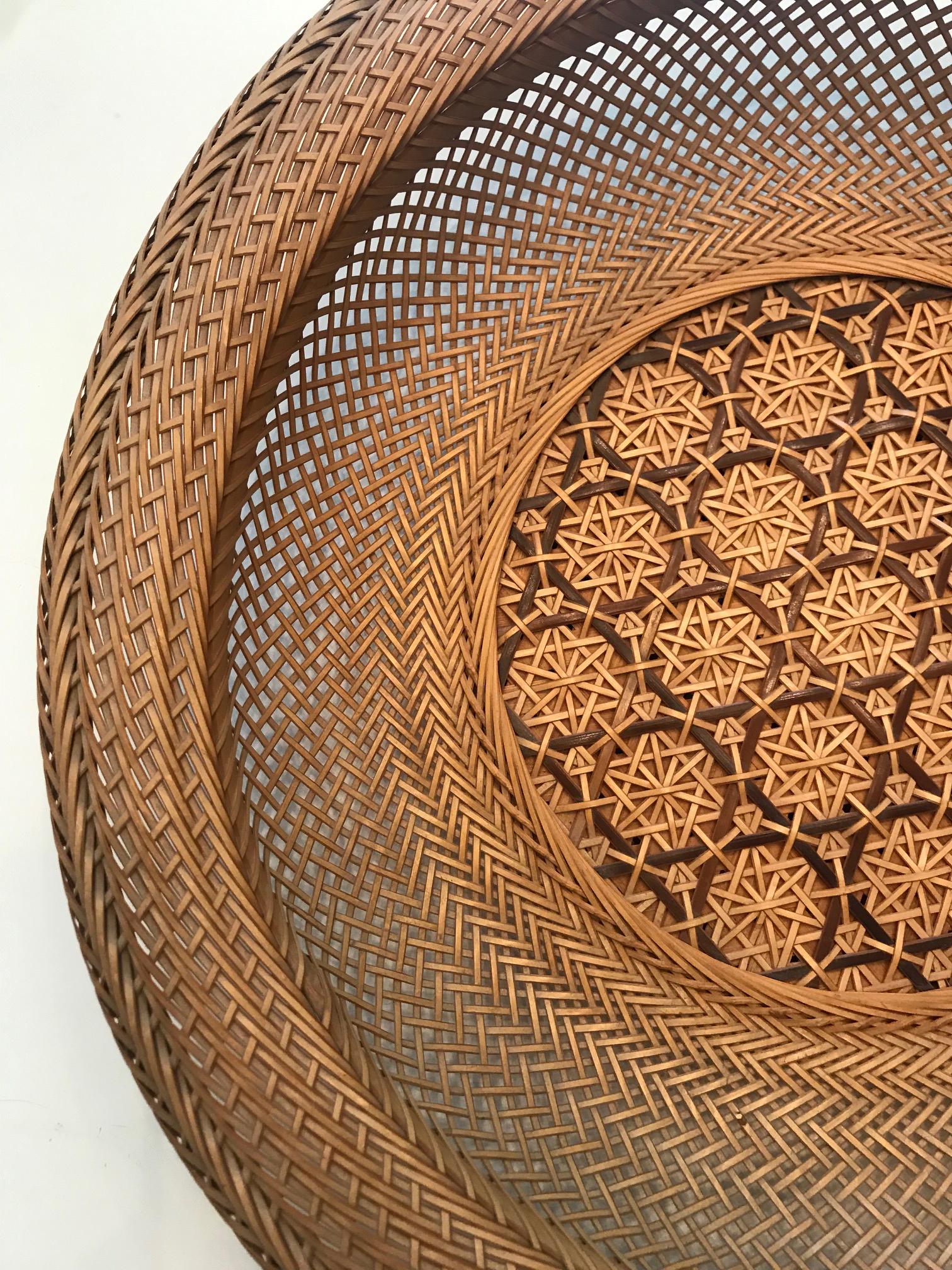 A wonderful piece of Bamboo art from Japan, circa mid-late 20th century. It was expertly woven in the form of a shallow open basket with wide rim, known in Japanese as 
