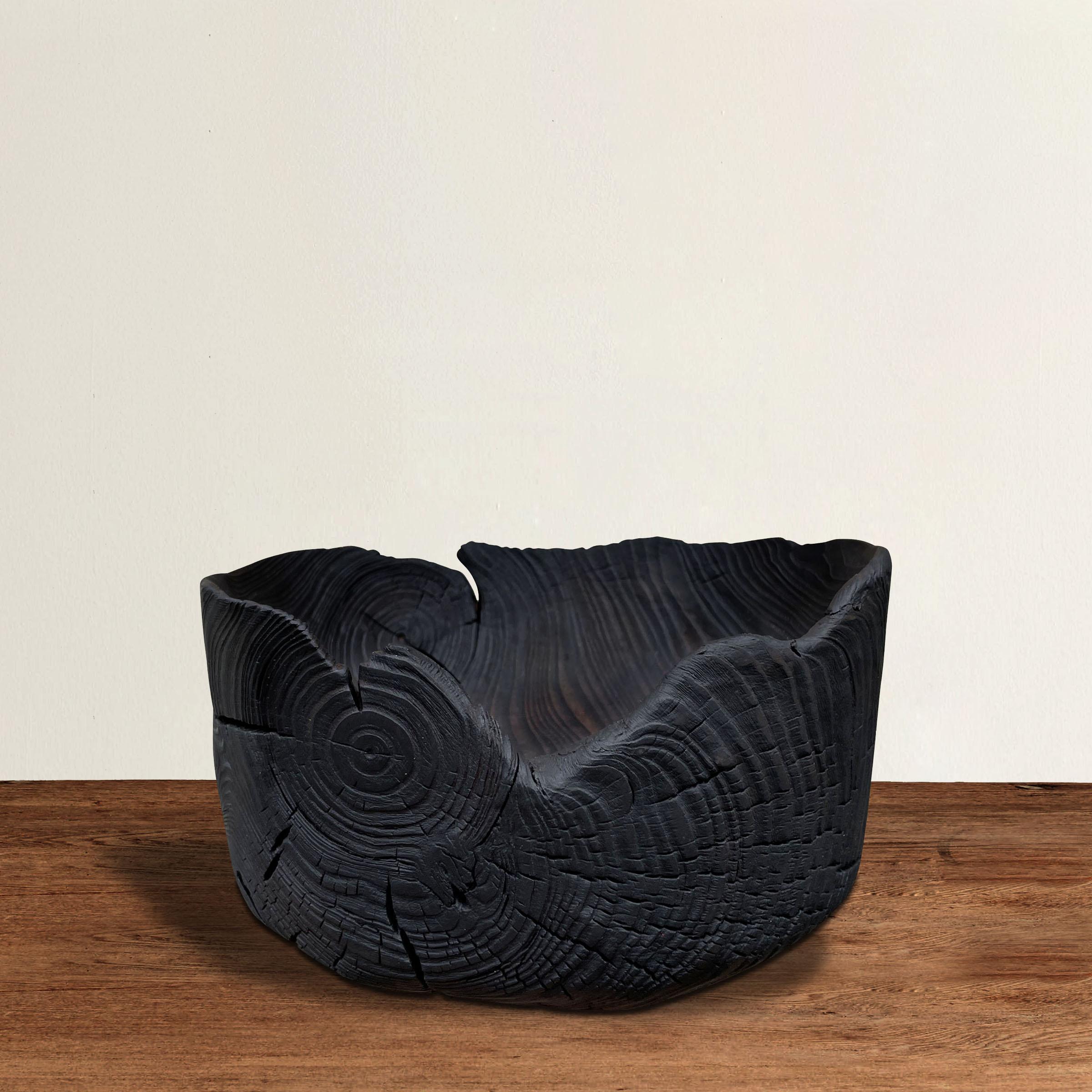 A fantastic Japanese bowl carved of one piece of pine and with a beautiful Yakisugi, or burned wood, finish. Traditionally, a yakisugi finish is applied to exterior siding of homes in Western Japan and was intended to improve the weather resistance