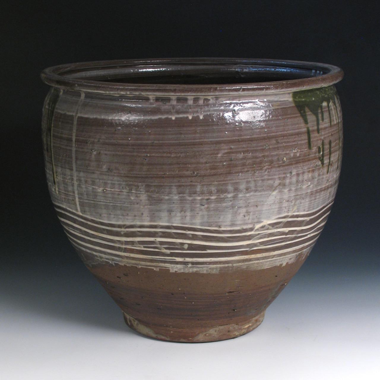 Japanese Yumino Wax Bean Storage Jar, northern Kyushu, Yumino kiln, well shaped and thickly potted stoneware jar, large well-rounded body with everted lip, lightly applied white slip with dripping copper-oxide green glaze with bottom section