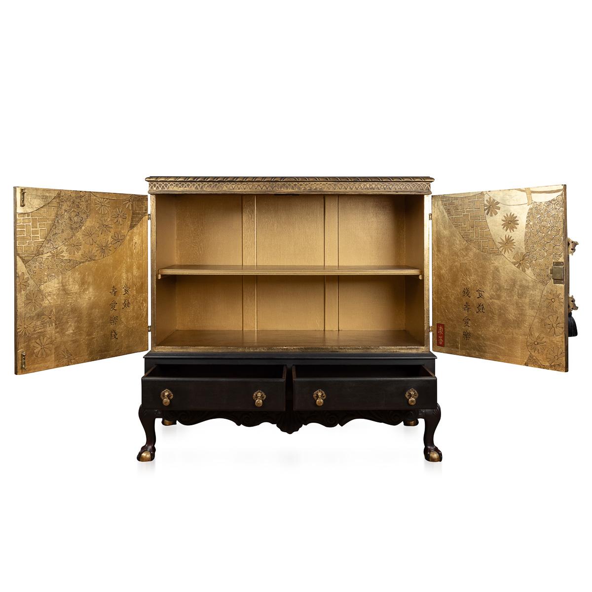 This exquisite cabinet, crafted from indigenous hardwood originating in Madagascar, showcases a captivating blend of artistry and craftsmanship. The substantial piece consists of two components: the cabinet itself, elegantly resting on a frame that