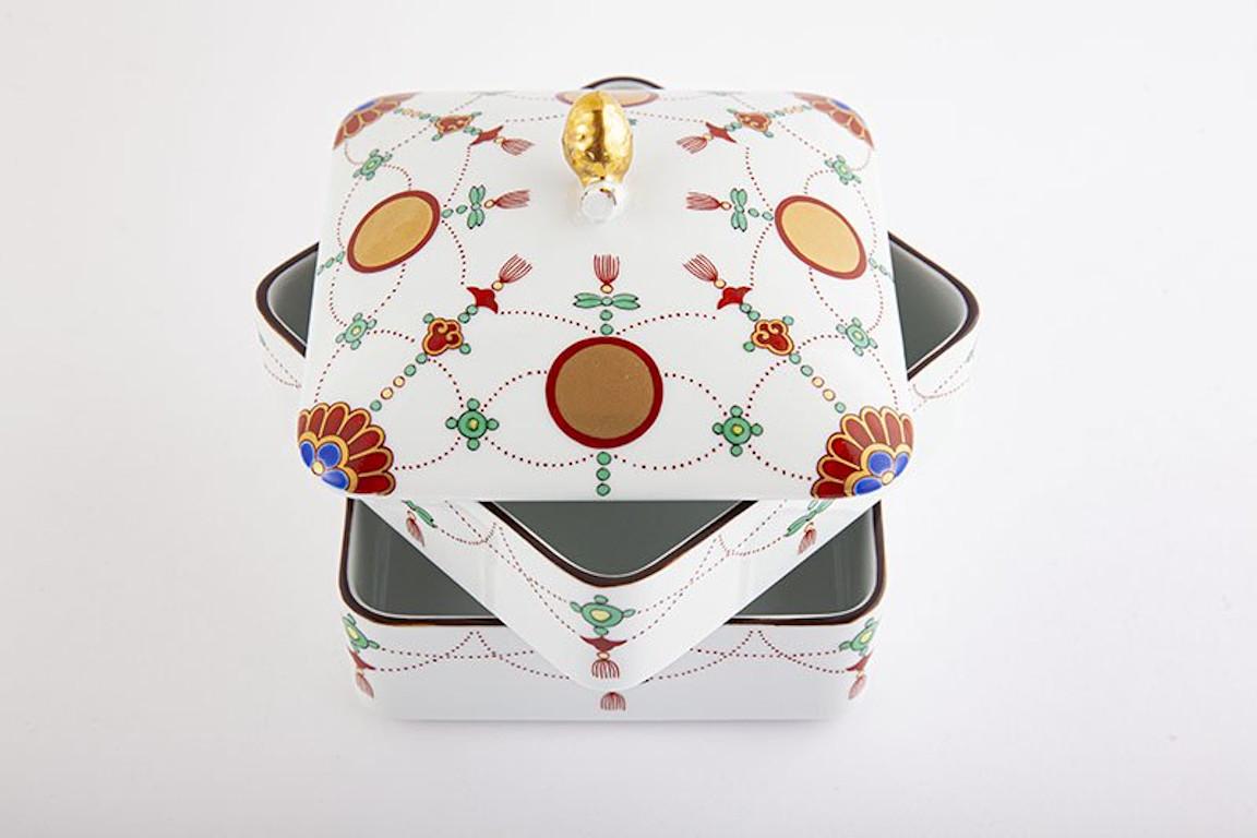 Contemporary Japanese Ko-Imari (old Imari) two tier box in a stunning square shaped porcelain in green, red and gold on pure white, crafted and signed by renowned Kiln of the Imari-Arita region of Japan, and is inspired by shapes and designs