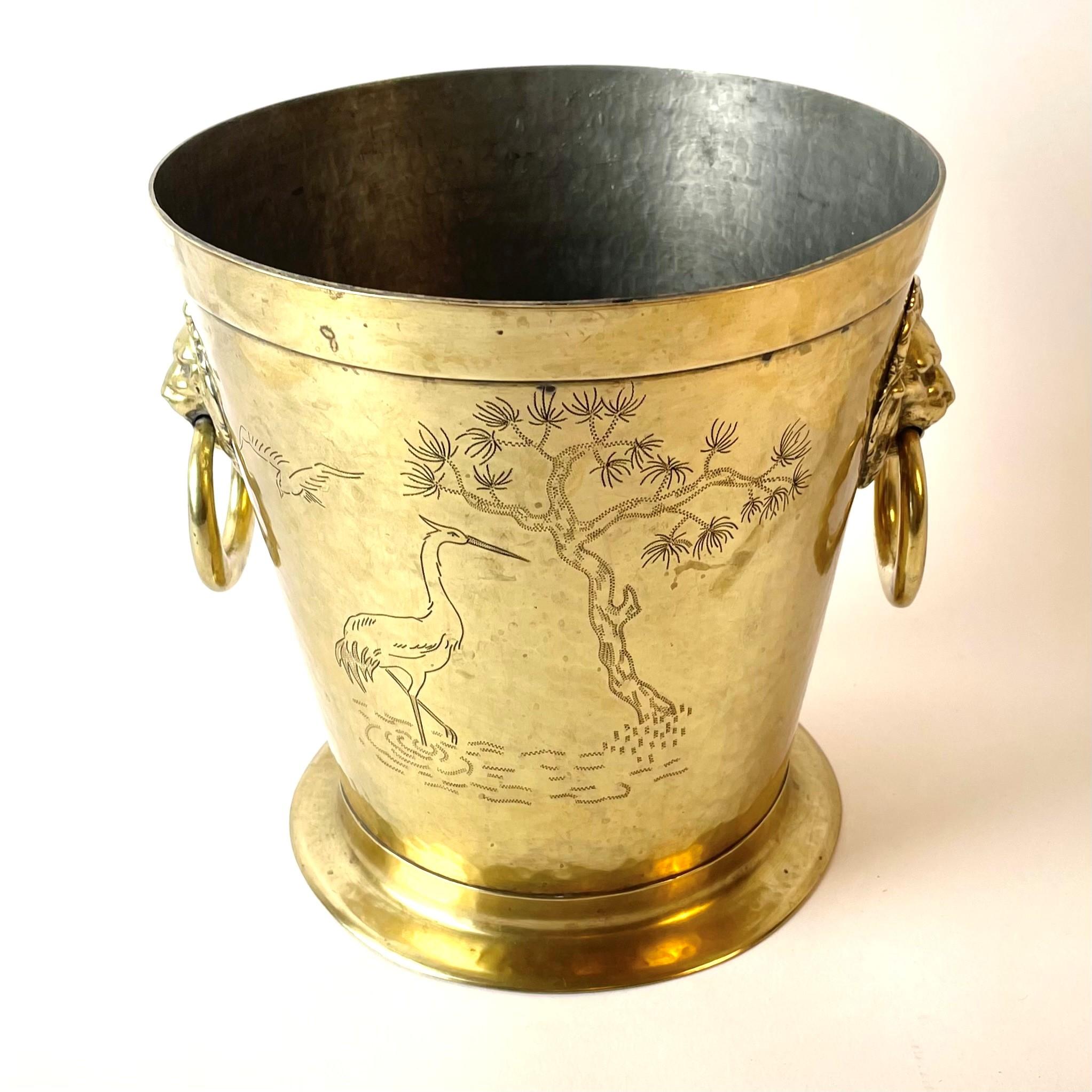 Beautiful wine cooler in brass, Japonaiserie, from early 20th century by Richard Ringström, Hälsingborg, Sweden. Tinned inside.

Wear consistent with age and use.