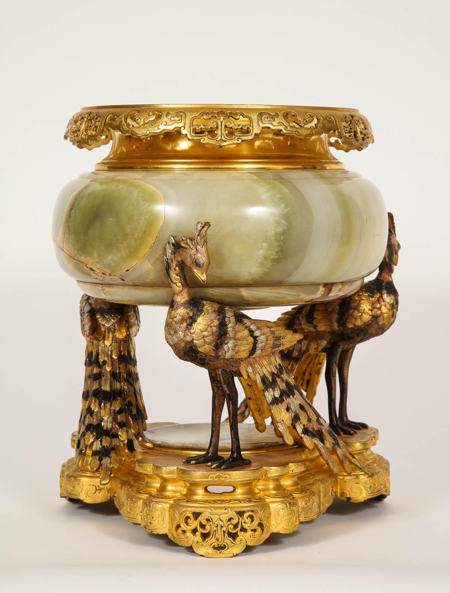 A beautiful French polychrome patinated dore bronze and silvered bronze with Algerian onyx mounted centerpiece, attributed to Eugene Cornu. This beautiful centerpiece was made in the 