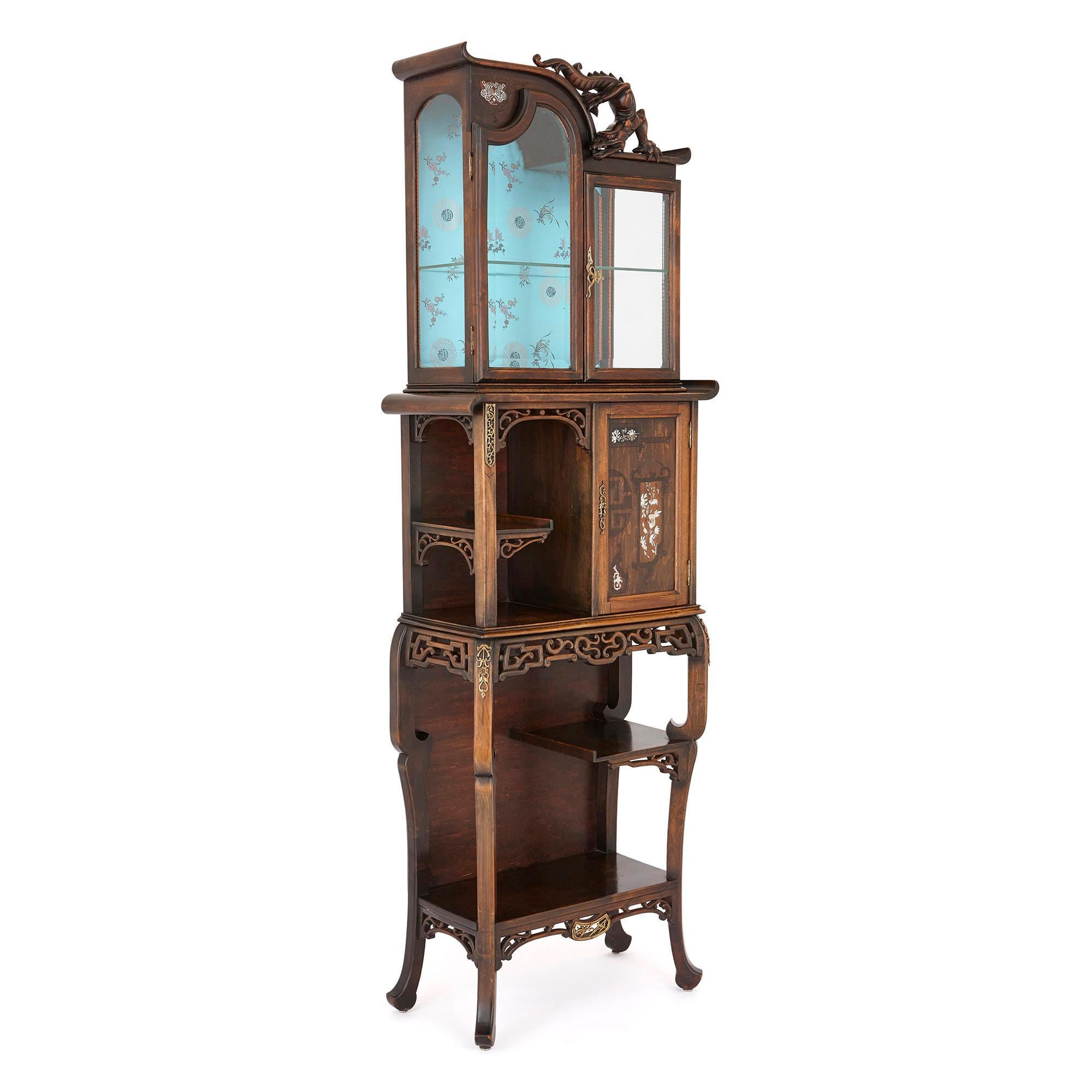This wonderful display cabinet is designed in a ‘Japonisme’ (Japanese) style, which was popular in Europe in the mid-late 19th century. This craze was kick-started by Japan reopening to trade with the West, and exporting Japanese goods—including