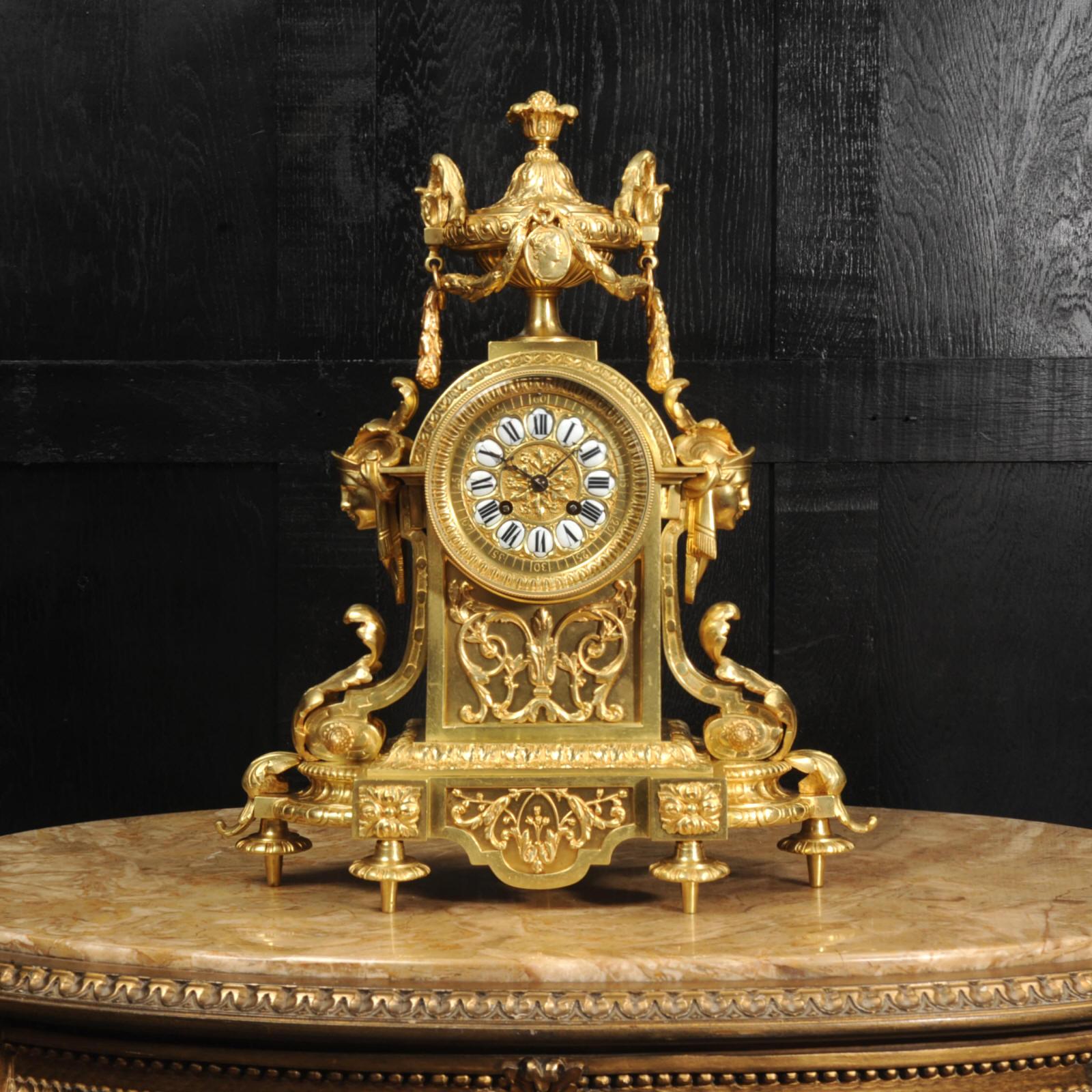 A large and heavy original antique French gilt-bronze clock, circa 1890. It is a beautifully made clock in the Neoclassical style of Louis XVI by G. Philippe, of the prestigious Gallery Montpensier of the Palais Royal. Of architectural form with two