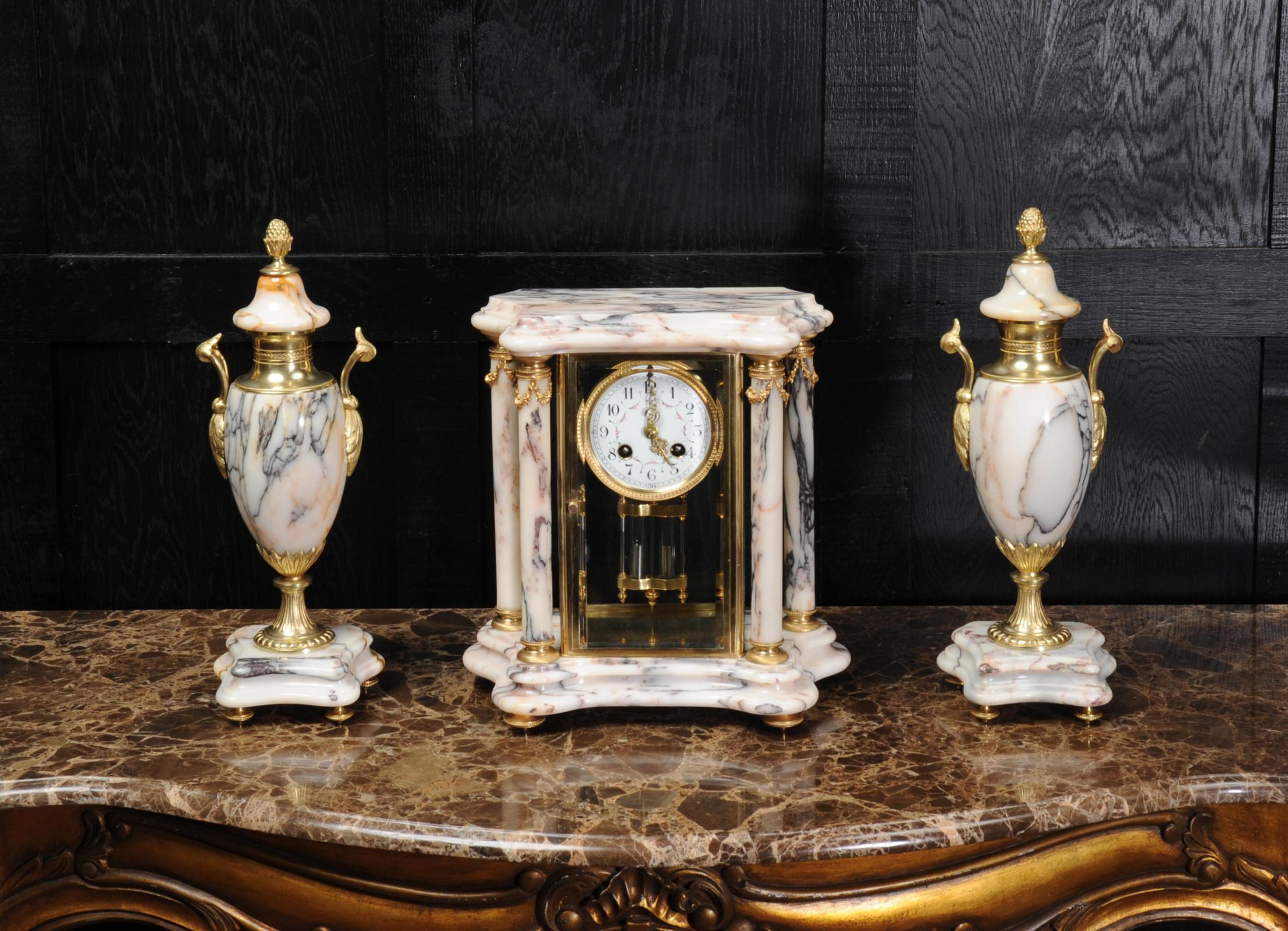 A beautiful original antique French four glass regulator clock set of the most beautiful variegated blue and orange specimen marble by Japy Freres. It is classical in style with four columns of marble and classical urns with pineapple finials.