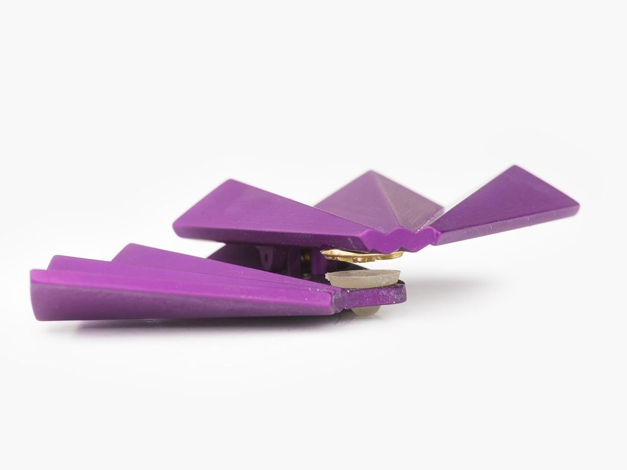 Purple aluminum fan shaped ear clips by JAR, Joel Arthur Rosenthal.  They are signed and numbered with signed pouch.