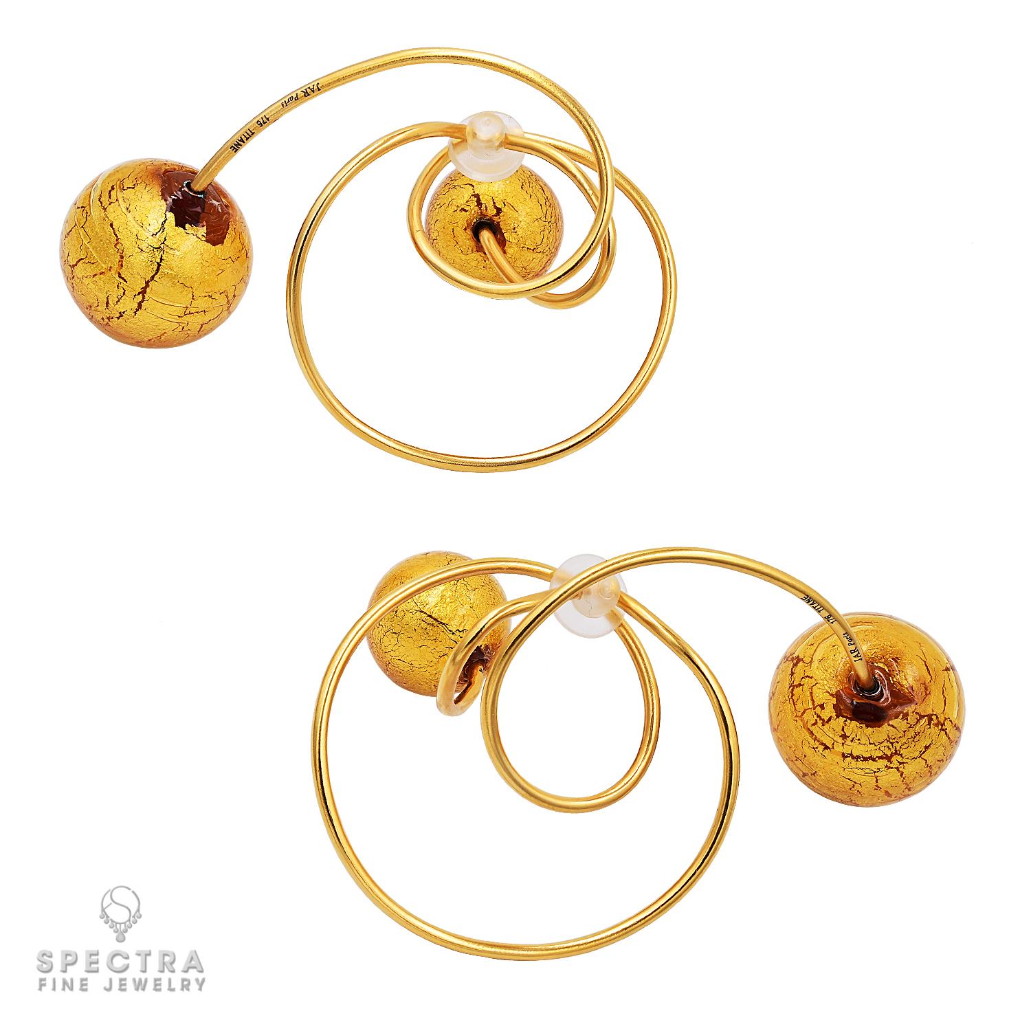 A striking celebration of artistry and imagination, these JAR “Carnavale de Venice” ear clips are a tribute to theatrical elegance. Crafted in a radiant gold-tone titanium, they are bold yet impossibly light, weighing just 26.40 grams. Their