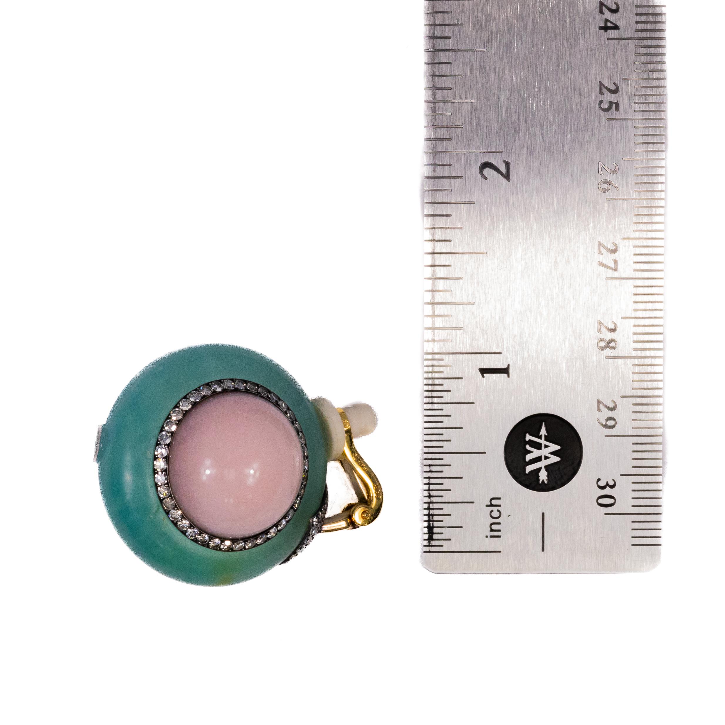 JAR Diamond, Chrysoprase & Pink Opal Earrings

A remarkable pair of earrings by JAR (Joel Arthur Rosenthal), crafted in 18k yellow gold. These stunning earrings feature a soft pink opalescent cabochon at the center, framed by a smooth halo of