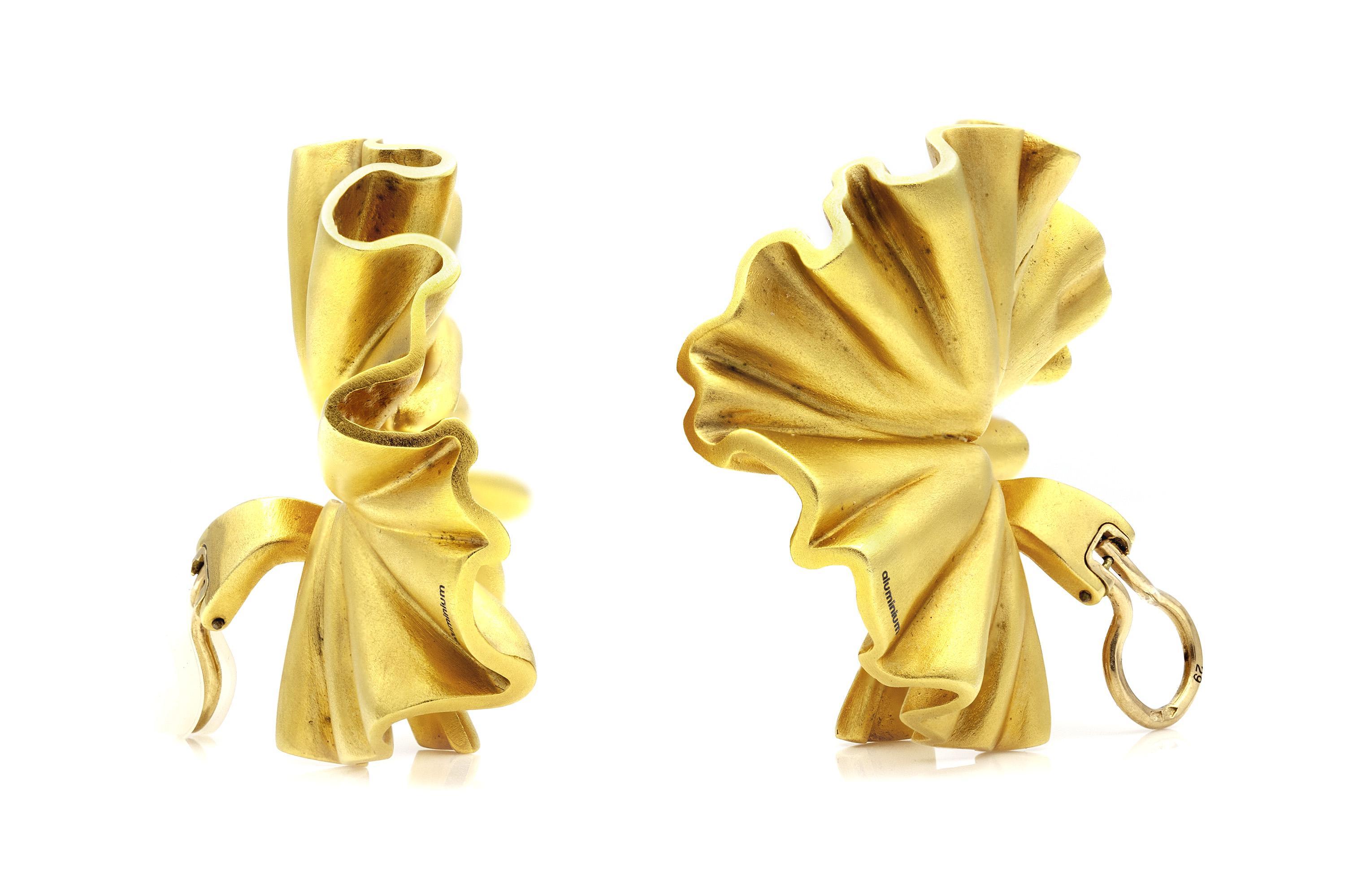 Finely crafted in gold dipped aluminum.
Signed by JAR (Joel Arthur Rosenthal)
1 7/8 inch diameter
