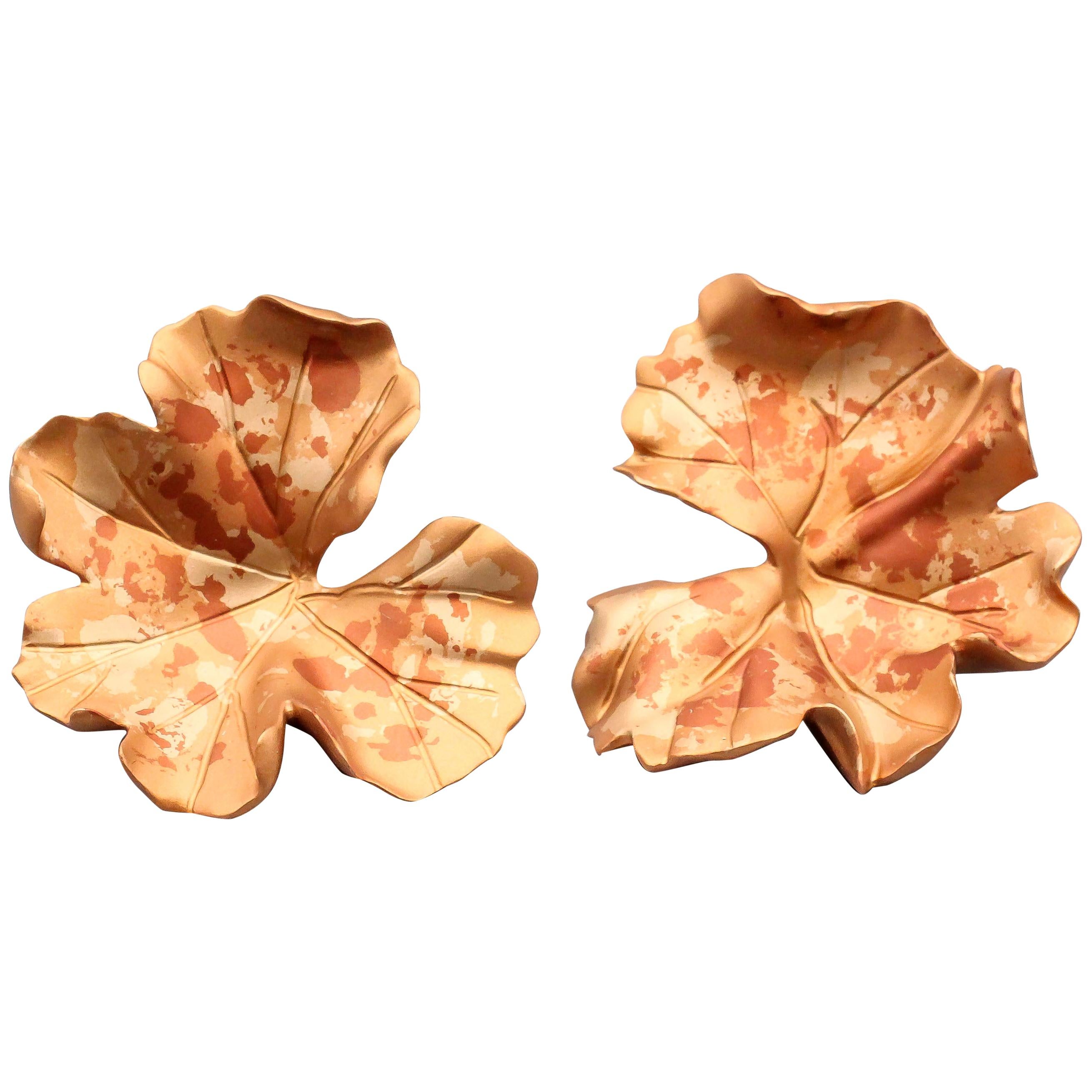 Immerse yourself in the enchanting beauty of nature with the JAR  Large Autumn Foliage Geranium Earclips. Designed by the legendary Joel Arthur Rosenthal, these earclips are a breathtaking celebration of the vibrant colors and intricate details