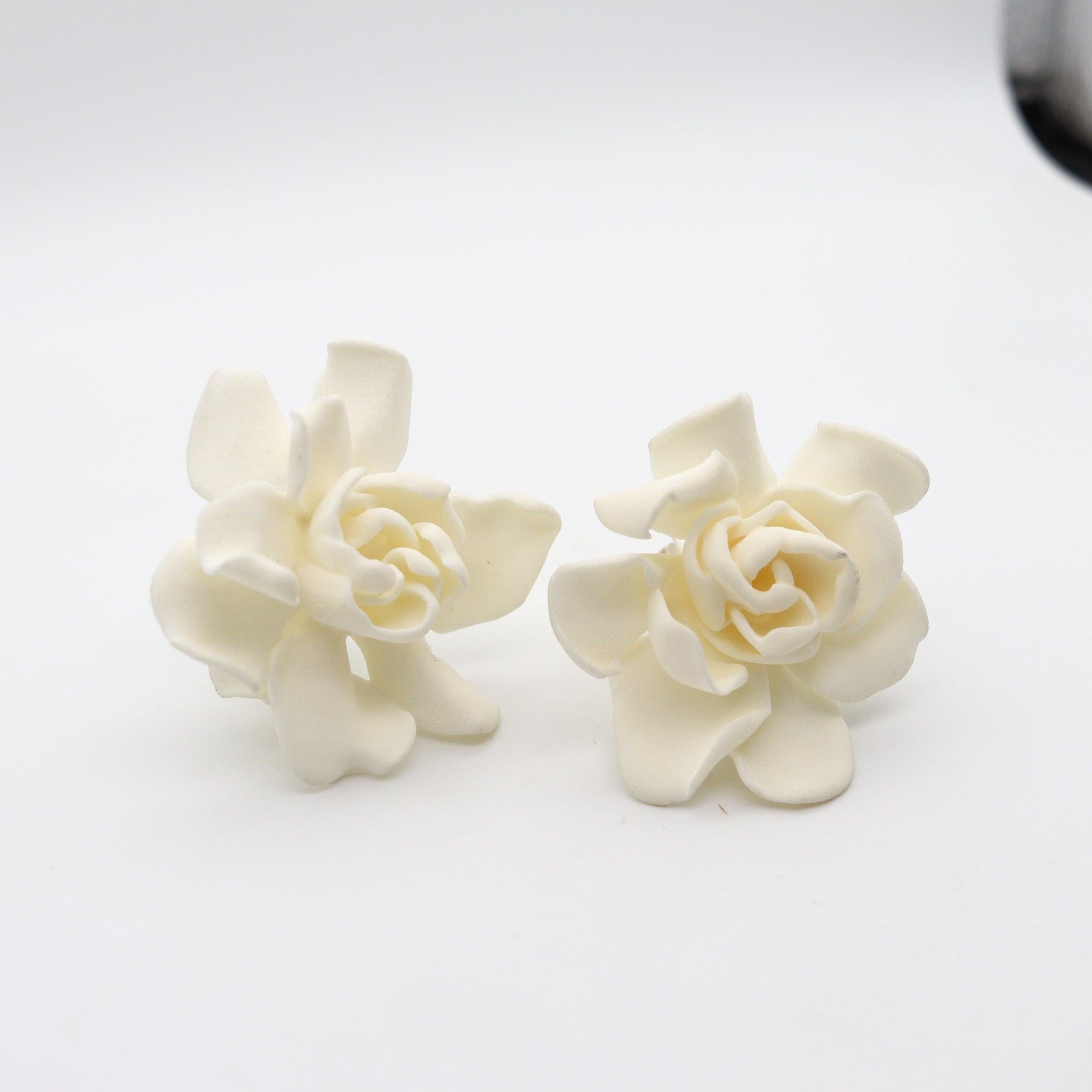 Pair of clips-on earrings designed by JAR Paris.

These are a splendid pair of clips-on earrings, created in Paris France by the iconic luxury jewelry designer Joel Arthur Rosenthal known as JAR Paris. The fabulous earring has been crafted in resin