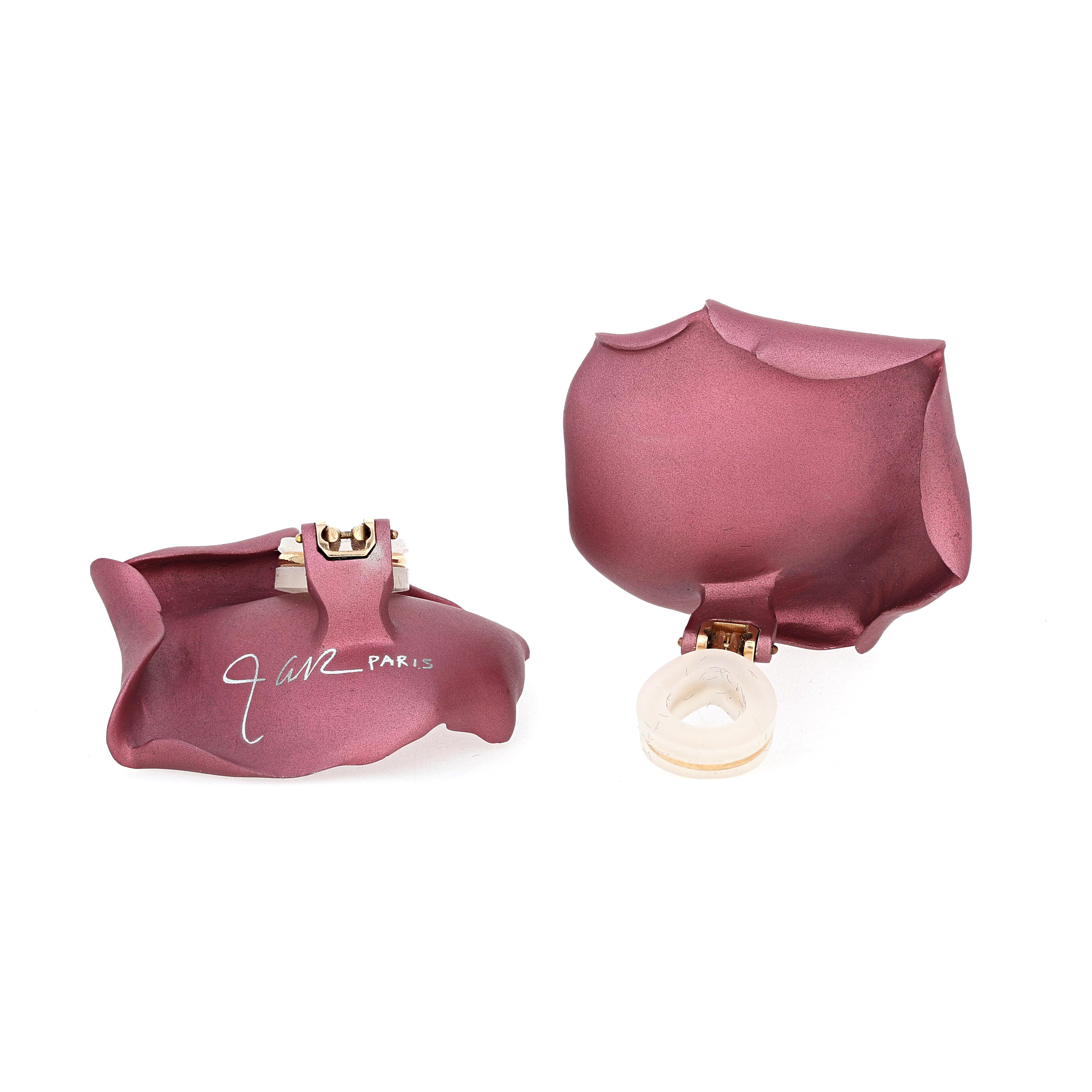 These unique Purplish- Pink/ mauve, sculpted aluminum earrings are signed 'JAR Paris' for Joel Arthur Rosenthal. They resemble a rose petal and have a beautiful matte finish. They are clip-on earrings and have an 18 karat yellow gold lever