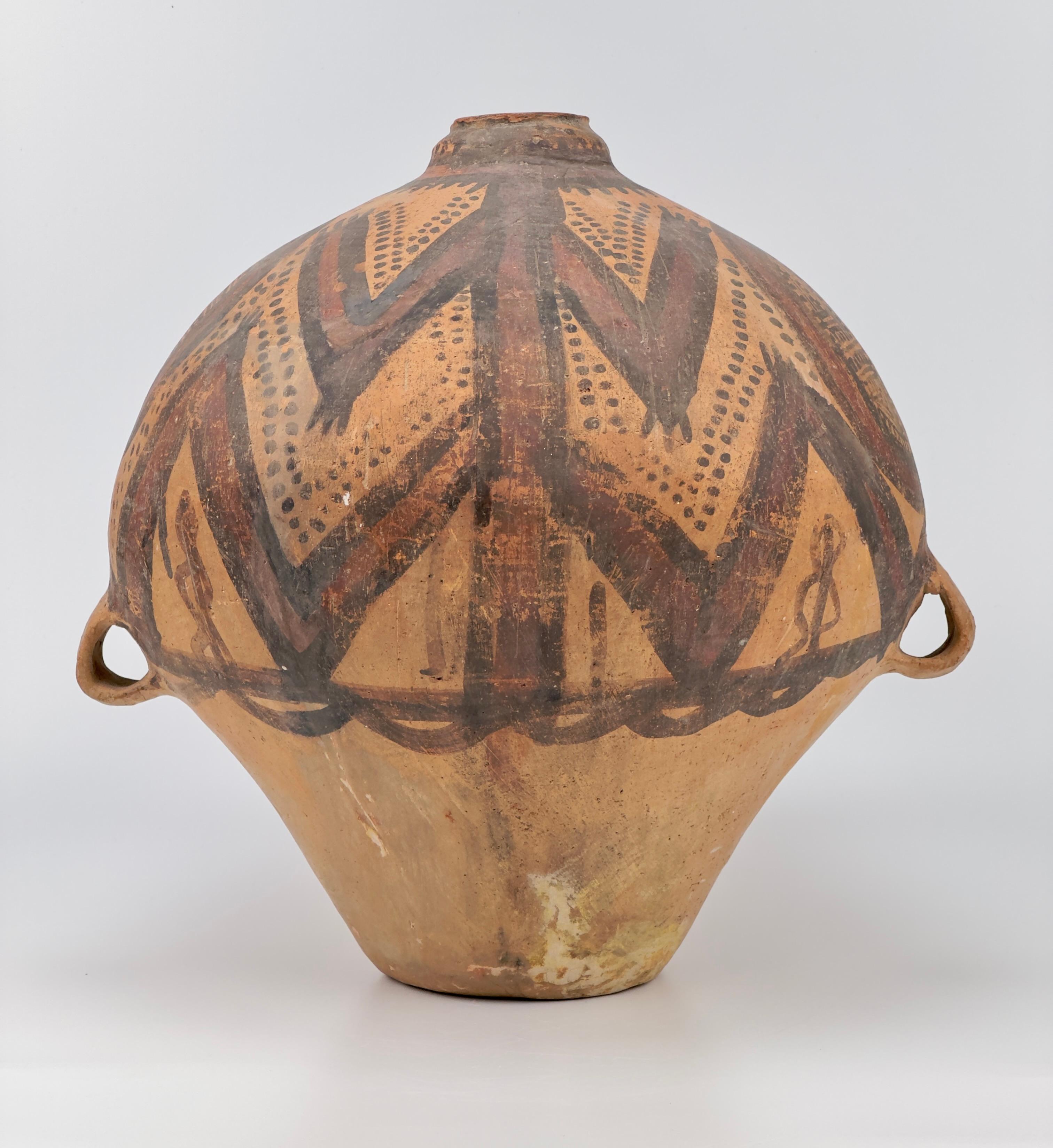 Large and small two-handled jars, pitchers, bowls, and beakers are the most common forms produced during the Machang phase of the Majiayao (or Gansu Yangshao) culture. The decorative motifs on Machang-period wares are primarily geometric, featuring