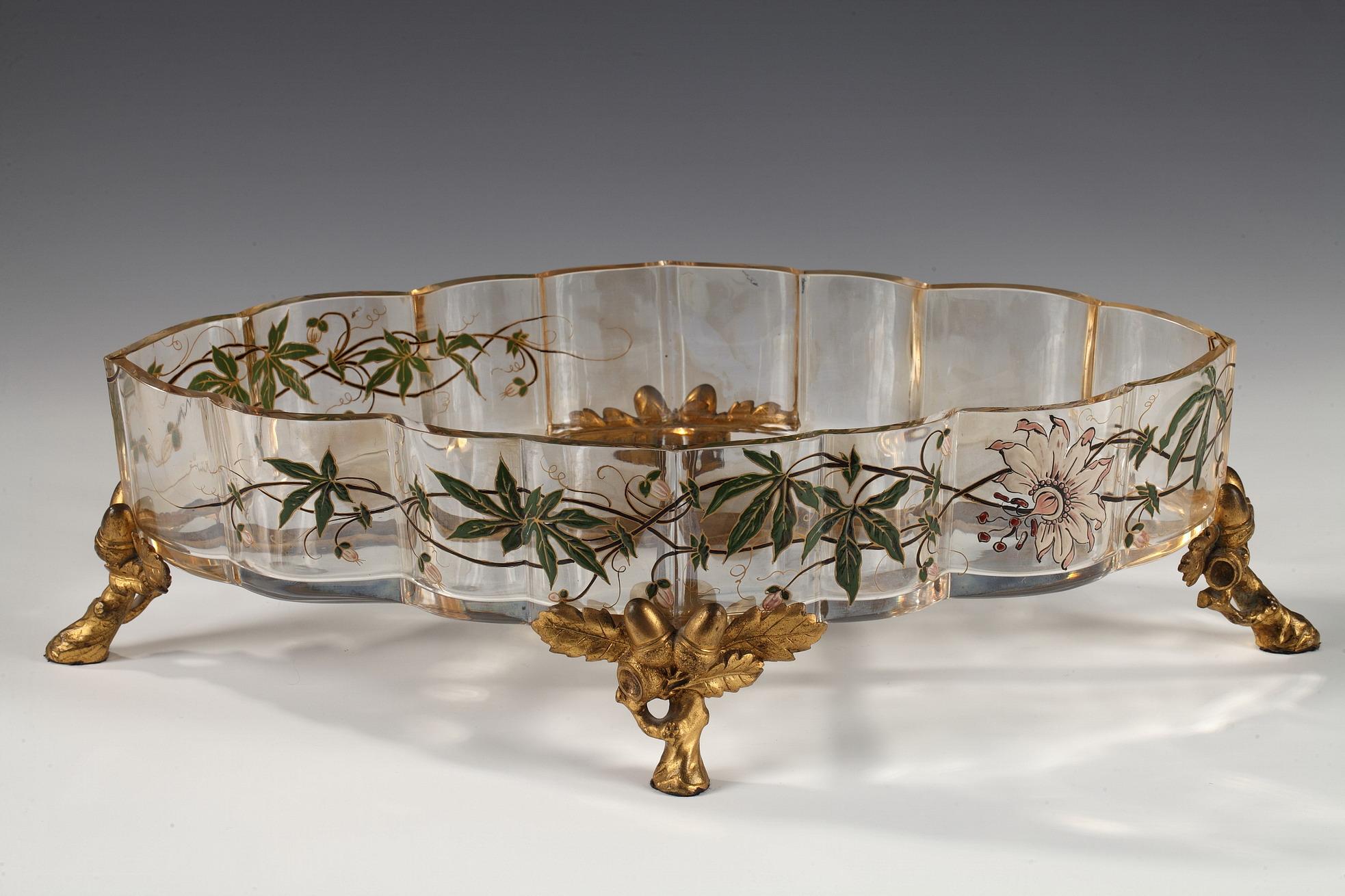 Mark of Baccarat on the mount
1 crystal planter + 1 bronze mount

A charming Baccarat crystal plant pot with a polychrome foliate enameled decoration, resting on a gilt bronze mount on four foliate, brushwood and acorn feet.

The decoration and the