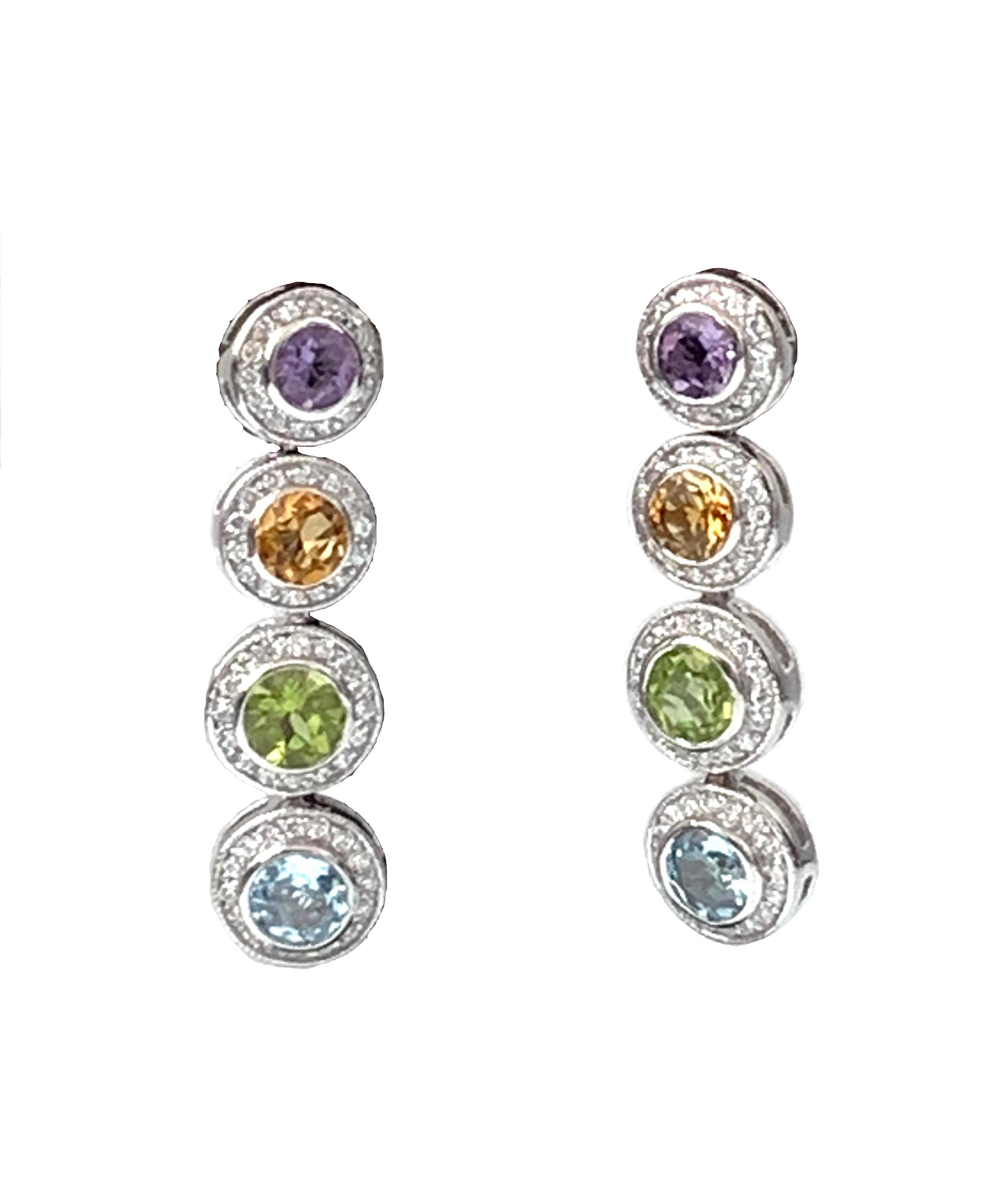Beautiful multicolor gemstones (Amethyst, Citrine, Blue Topaz, and Peridot) adorned with round Cubic Zirconia drop earrings. Platinum rhodium finished. Straight post. Marked: Jarin

1-3/4