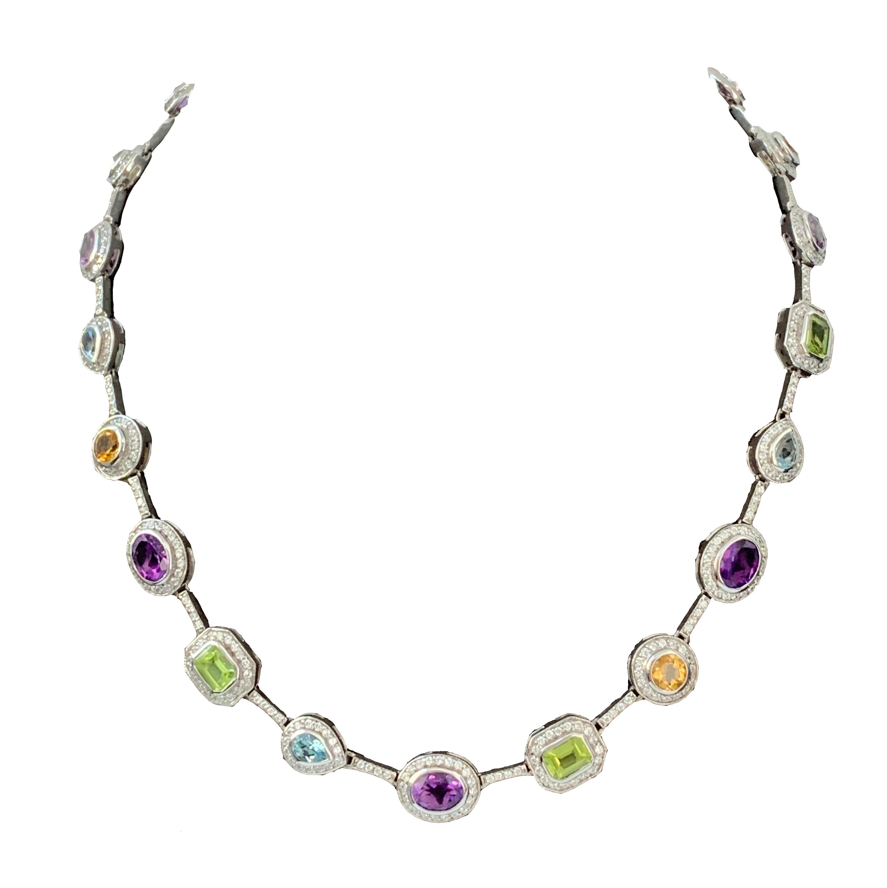 Beautiful multicolor gemstones (Amethyst, Citrine, Blue Topaz, and Peridot) adorned with round Cubic Zirconia cecklace. Handset on platinum rhodium plated sterling silver. Push clasp closure with 