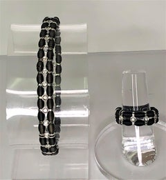 Bracciale e anello Jarretiere in oro nero 18k