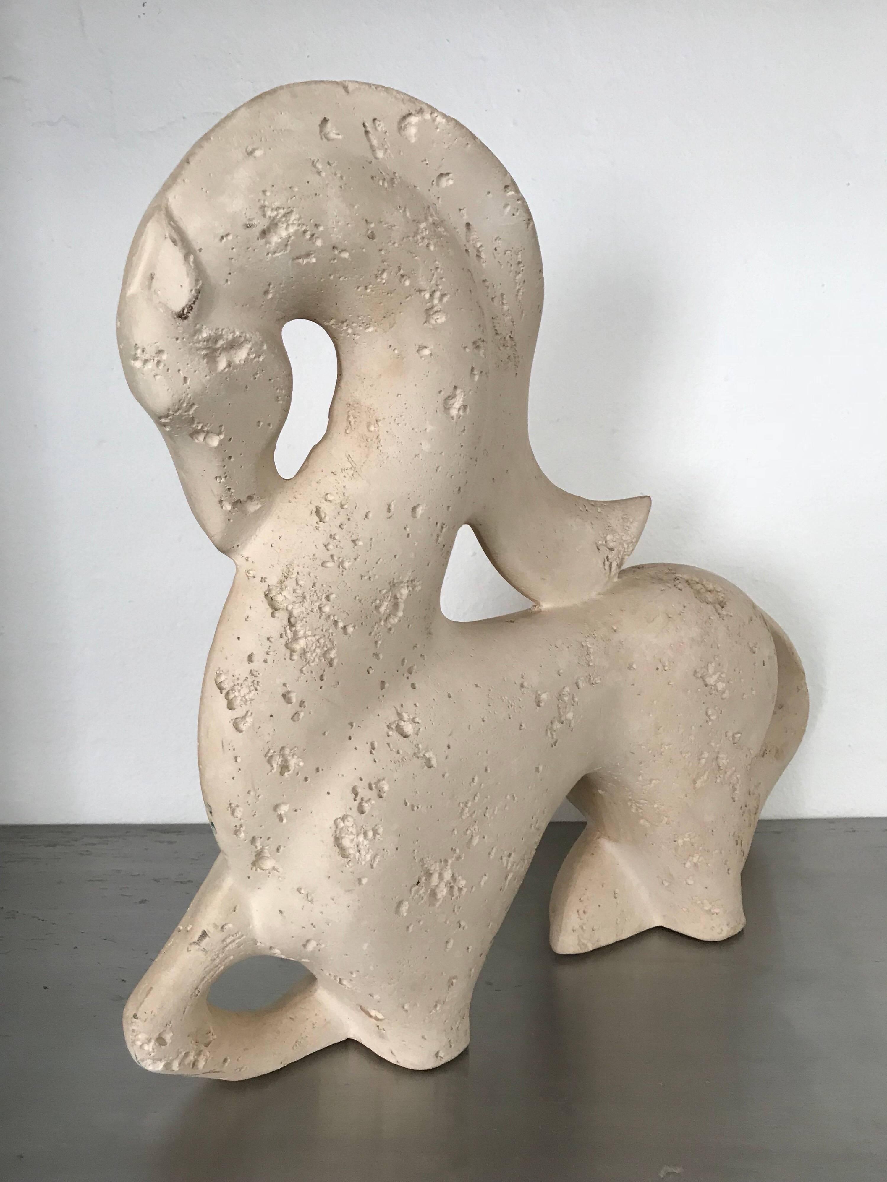 Abstract sculpture of a horse by Jaru rendered in cast stone.