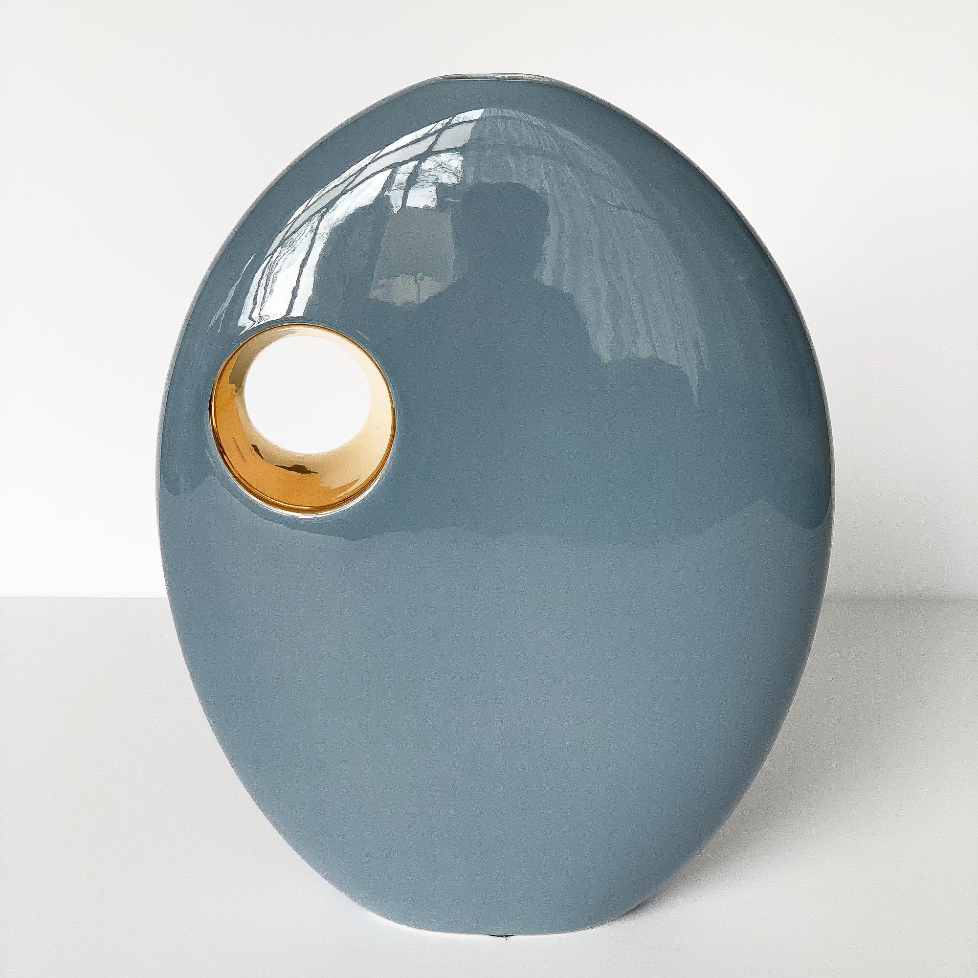 Jaru blue glazed and gold sculptural ceramic vase. Pale grayish blue glaze. Metallic gold glaze on the interior of the 3