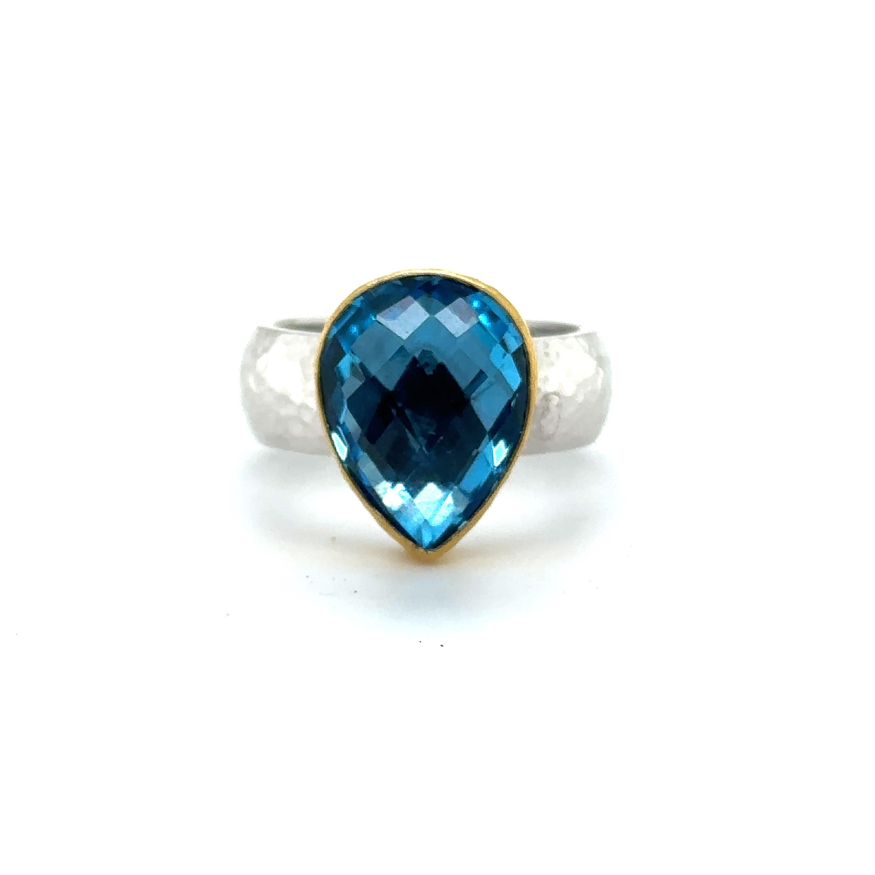 24KT GOLD/SS RING 8.00CT with PEAR SHAPE SWISS BLUE TOPAZ
Metal: 24K GOLD/ SS
Stone Info: 8.00CT PEAR SHAPE SWISS BLUE TOPAZ
Total Stone Weight: 8.00 Cwt.
Item Weight: 11.05 gm
Ring Size: 8  (Re-sizable)
Measurements:  16.5mm X 12.5mm
