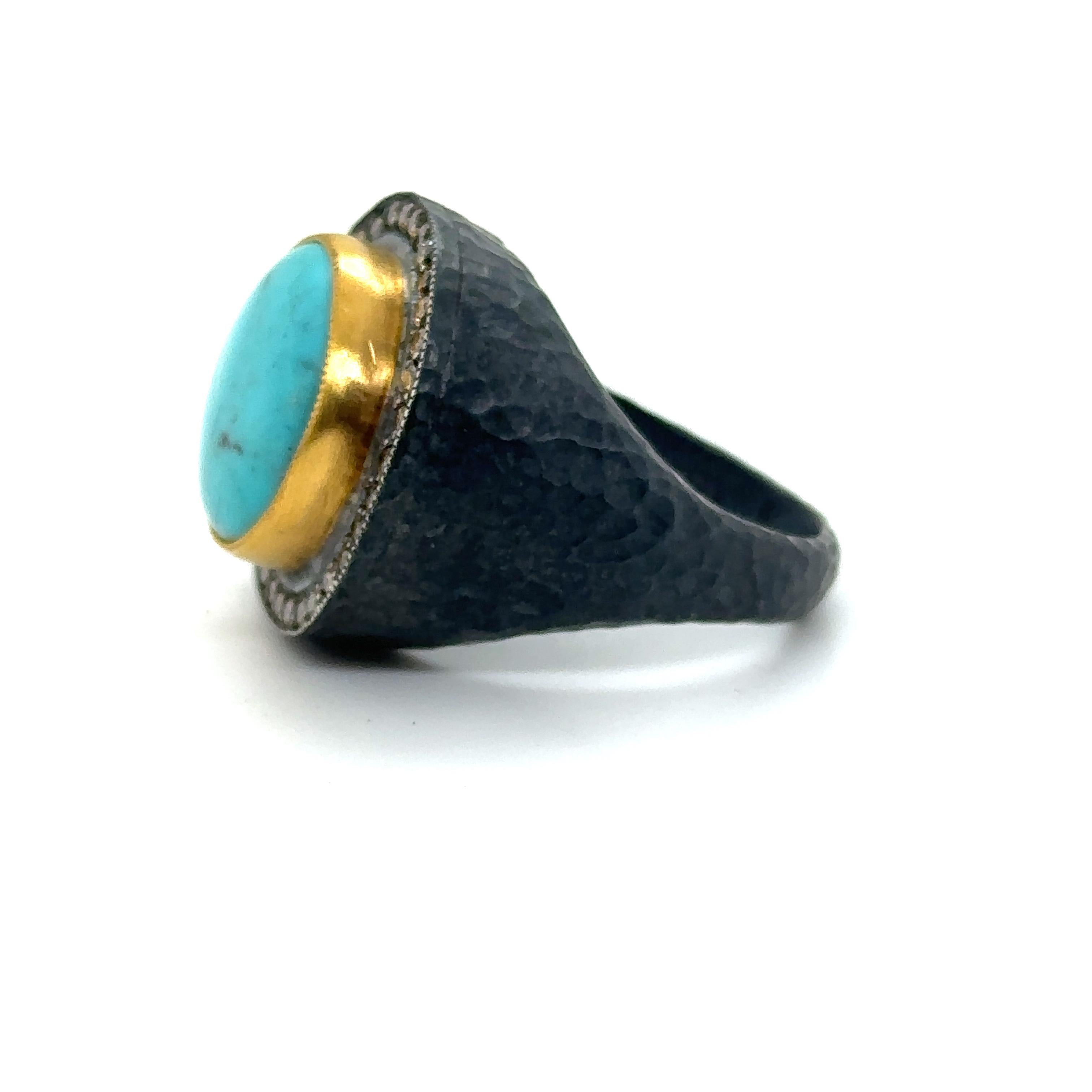 24KT GOLD/SS TURQUOISE RING with CHAMPAGNE DIAMONDS
Metal: 24K GOLD/OXIDIZED SS
Diamond Info: CHAMPAGNE DIAMONDS SI/12 
Stone Info: 15MM ROUND TURQUOISE
Total Diamond Weight: 0.50 cwt.
Total Stone Weight: 13.00 cwt.
Item Weight: 17.60 gm
Ring Size: 
