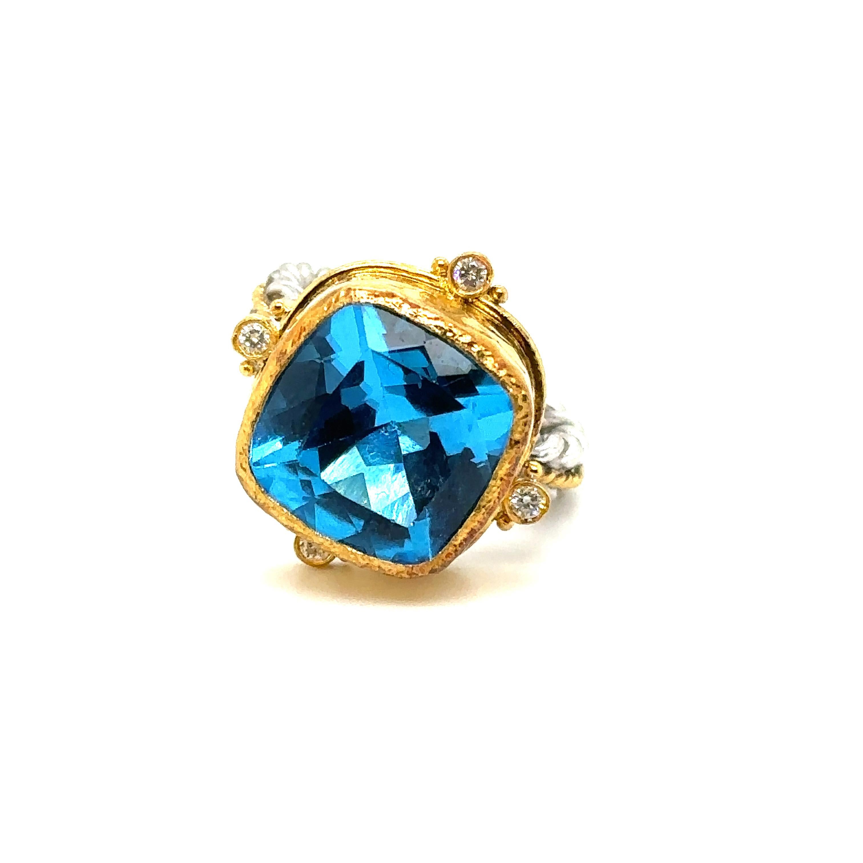 24K GOLD/STERLING SILVER RING 0.10Ct DIAS. 
Metal: 24K GOLD/SS
Diamond Info: H/I COLOR VS2-3 DIAMONDS
Stone Info: 14MM CUSHION CUT SWISS BLUE TOPAZ 12.50CT
Total Diamond Weight: 0.10 cwt.
Item Weight: 10.90 gm
Ring Size: 7 (Not