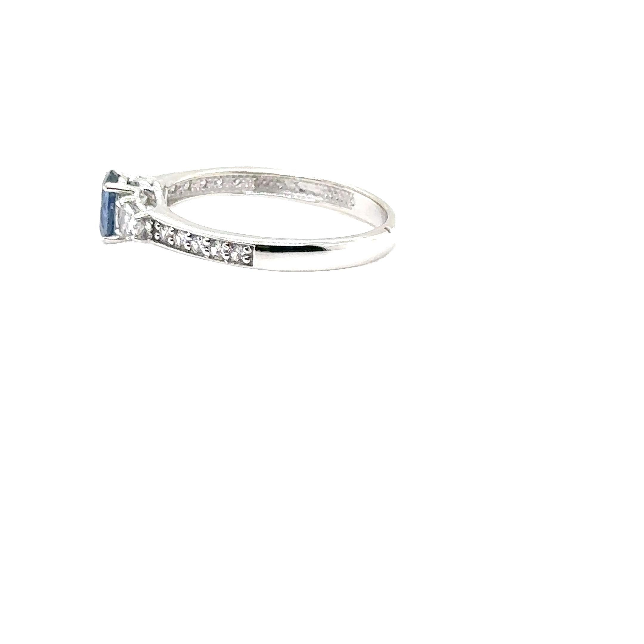 14K WHITE GOLD OVAL SAPPHIRE RING with WHITE SAPPHIRES & DIAMONDS
Metal: 14K WHITE GOLD
Diamond Info: GH-SI DIAMONDS 0.20CT
Stones Info: 6X4 OVAL SAPPHIRE 0.60CT
        4x3 PEARSHAPE WHITE SAPPHIRES 0.20CT
Total Dia Weight: 0.20 cwt.
Total Stones
