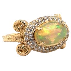 JAS-21-2249 - 14K YG 0,55Ct G/H SI1 DIAMONDS & 12X8MM 4,50Ct ETHIOPIAN OPAL