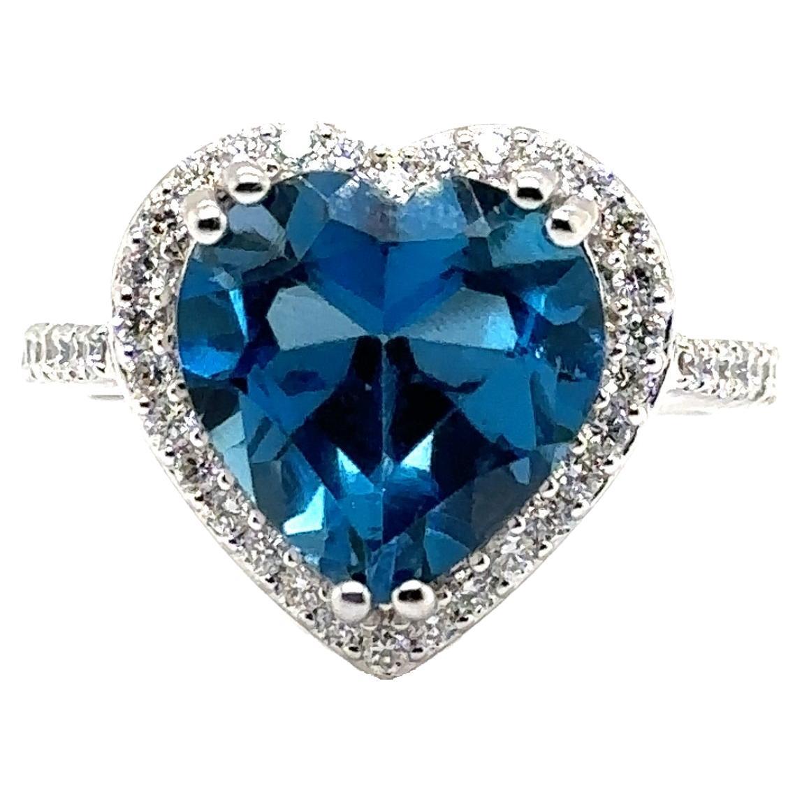 JAS-21-2259 - 14K WG 0.75Ct GH-SI1 DIAMONDS & 12MM HEART SHAPE LONDON BLUE TOPAZ For Sale