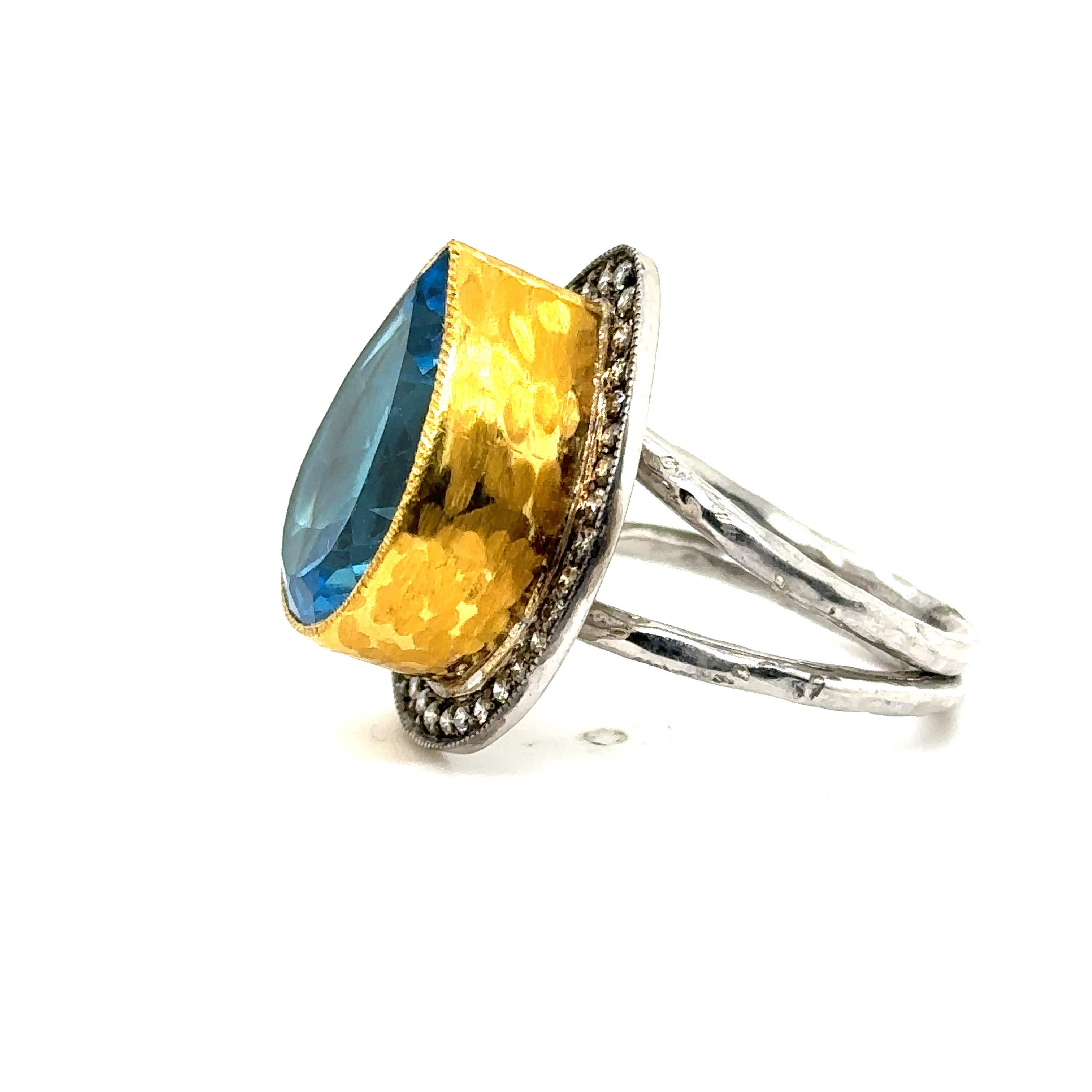 24K GOLD/STERLING SILVER RING 0.40Ct CHAMPAGNE DIAS. 
Metal: 24K GOLD/SS
Diamond Info: 
CHAMPAGNE DIAMONDS SI/12 0.40 CT
Stone Info: 
18X13MM PEAR SHAPE SWISS BLUE TOPAZ 14 CT
Total Diamond Weight: 0.40 Cwt.
Item Weight: 13.25 gm
Ring Size:  8 (Not