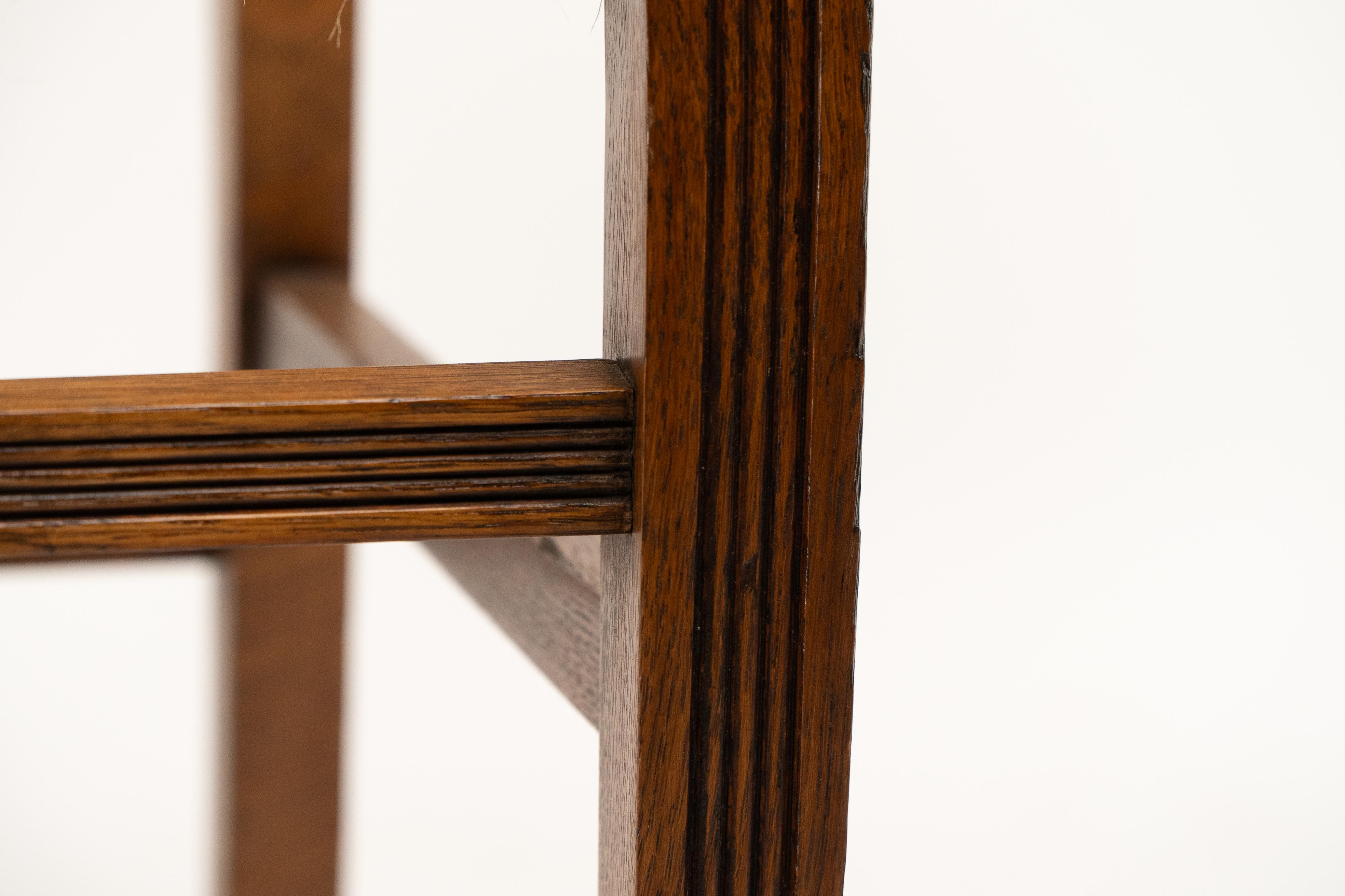 Jas Shoolbred. A set of four Aesthetic Movement lattice back oak dining chairs 6