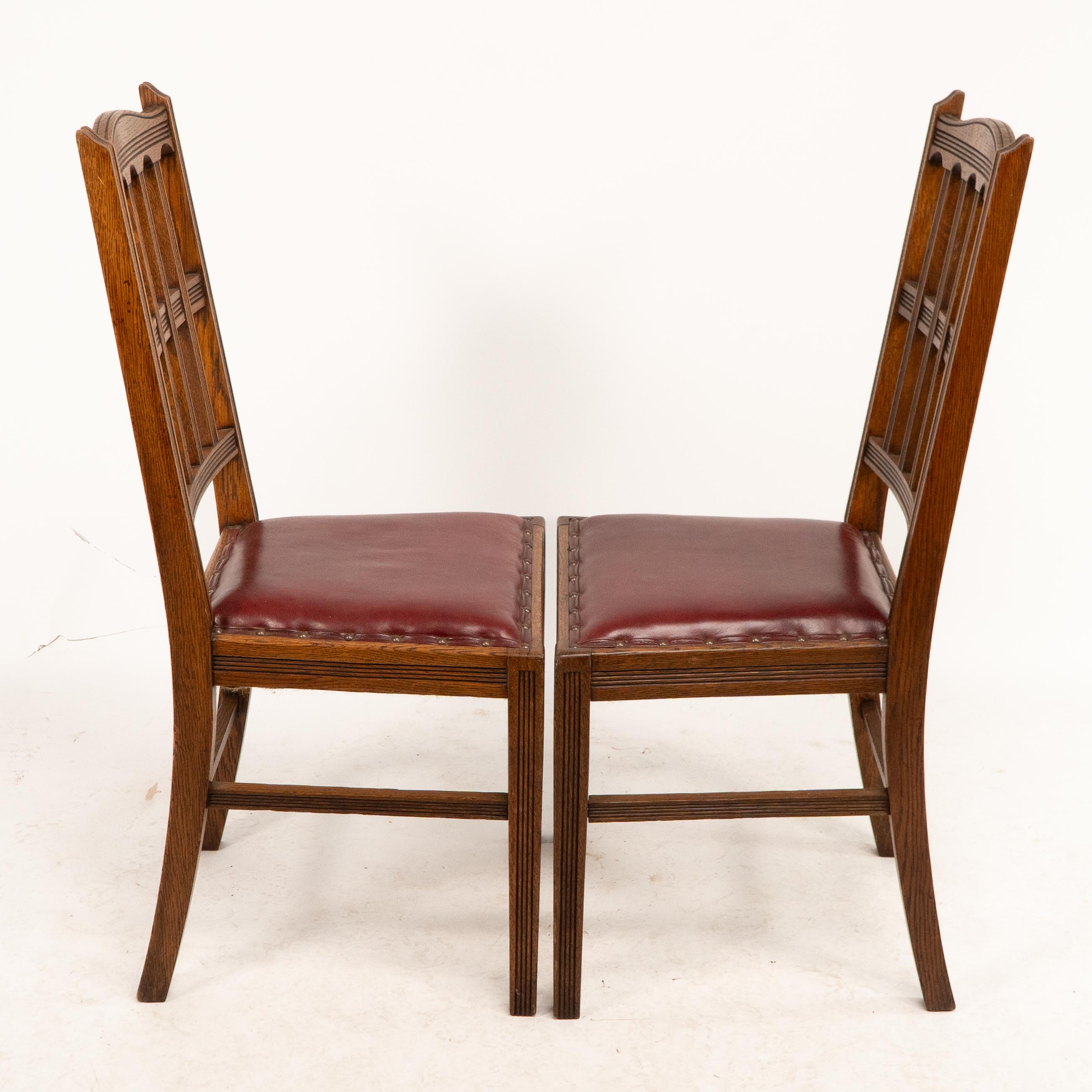 Arts and Crafts Jas Shoolbred. A set of four Aesthetic Movement lattice back oak dining chairs